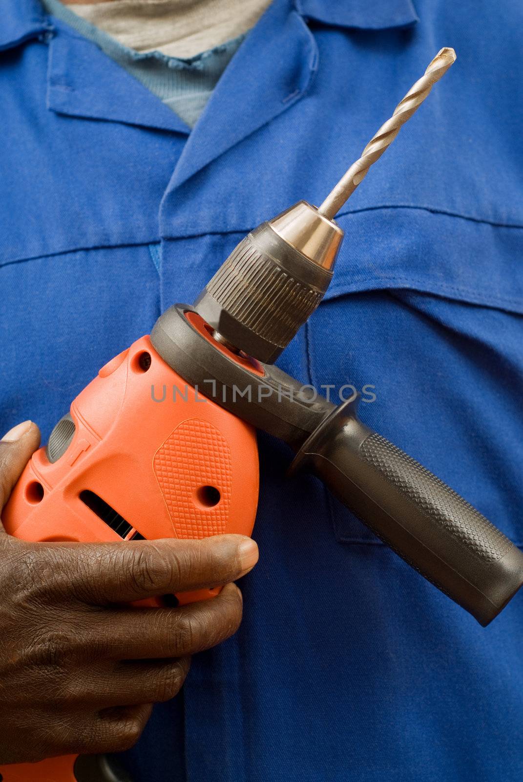 Close up of construction worker with power tool in hands