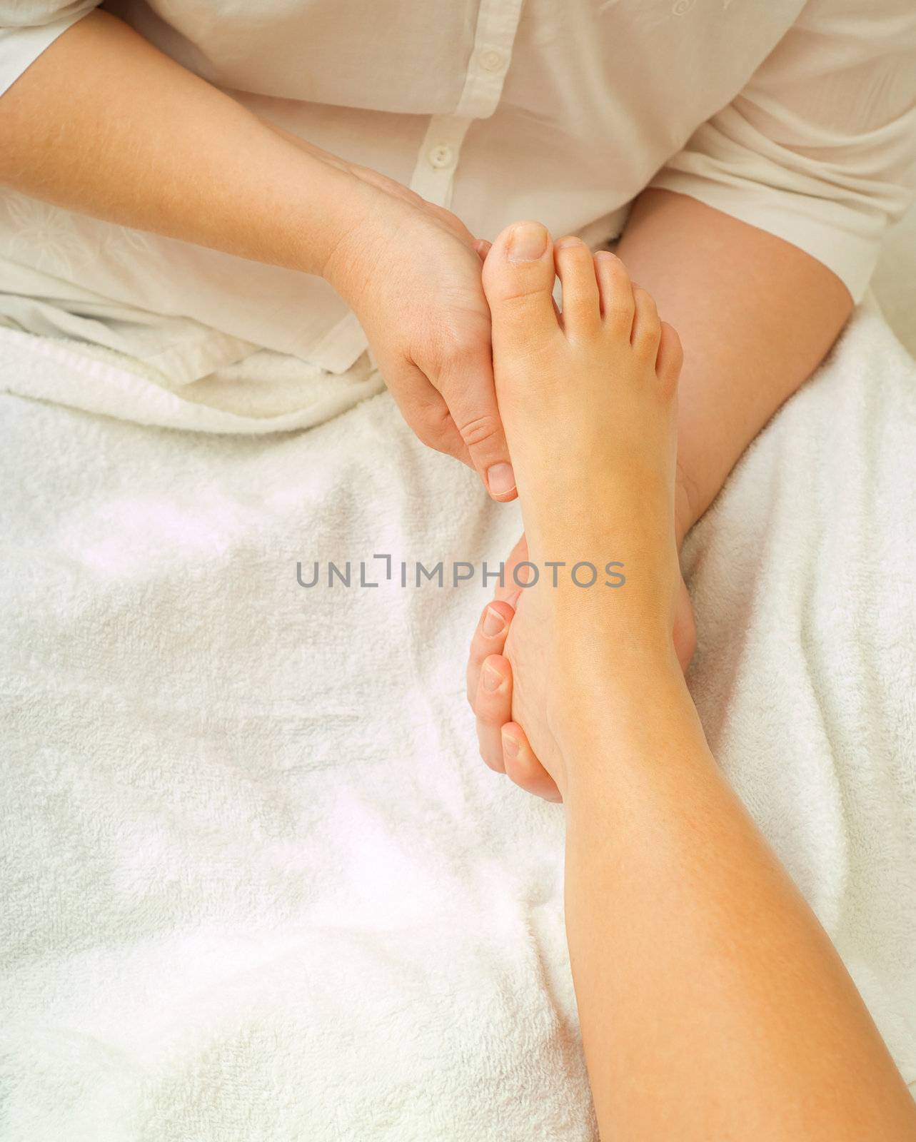 Feet in spa massage bath by alistaircotton