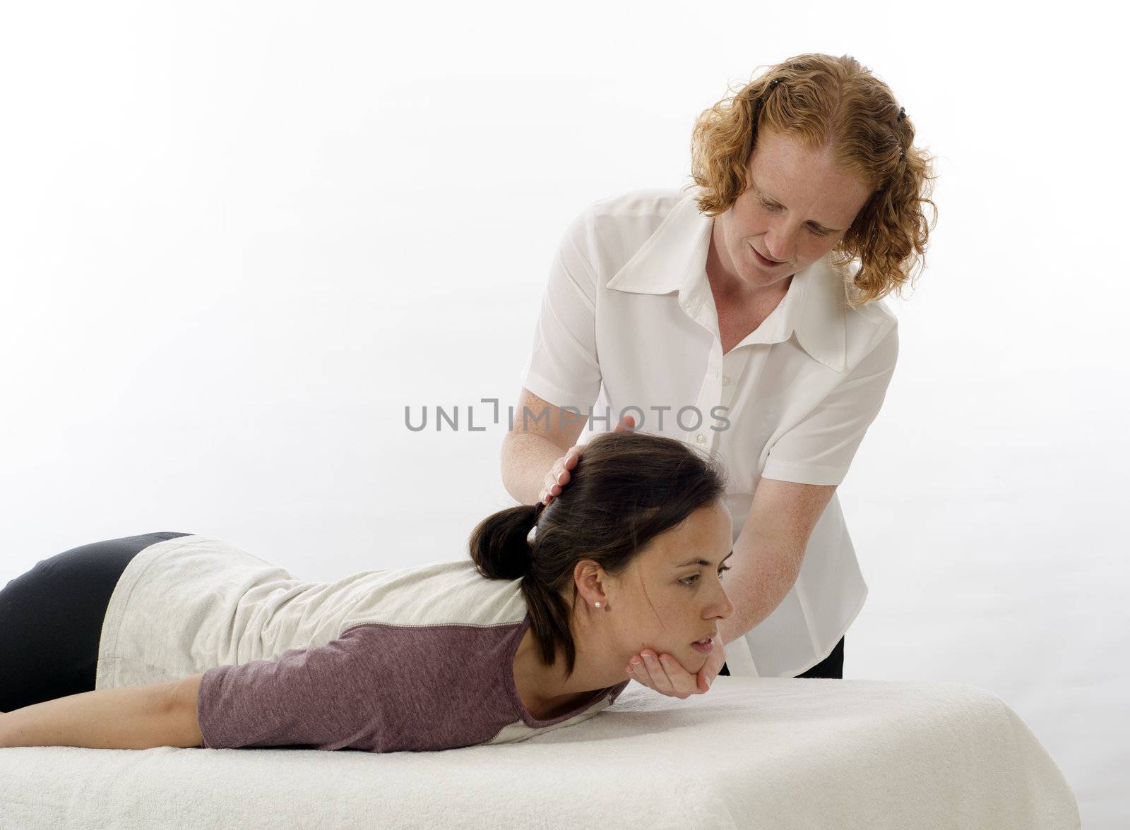 Kinesiologist or physiotherapist treating neck muscles
