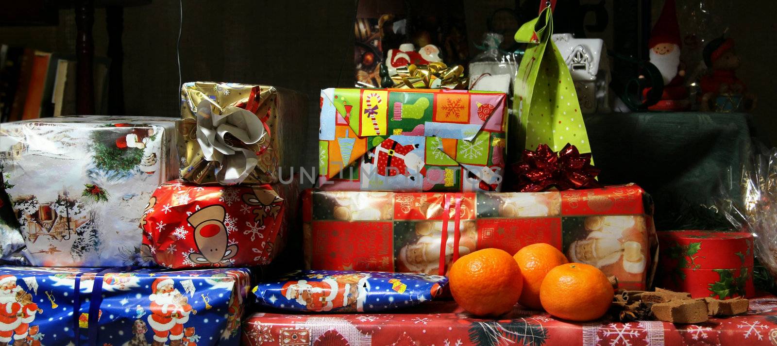 Lot of Christmas gifts wrapped in the beautiful vivid paper 