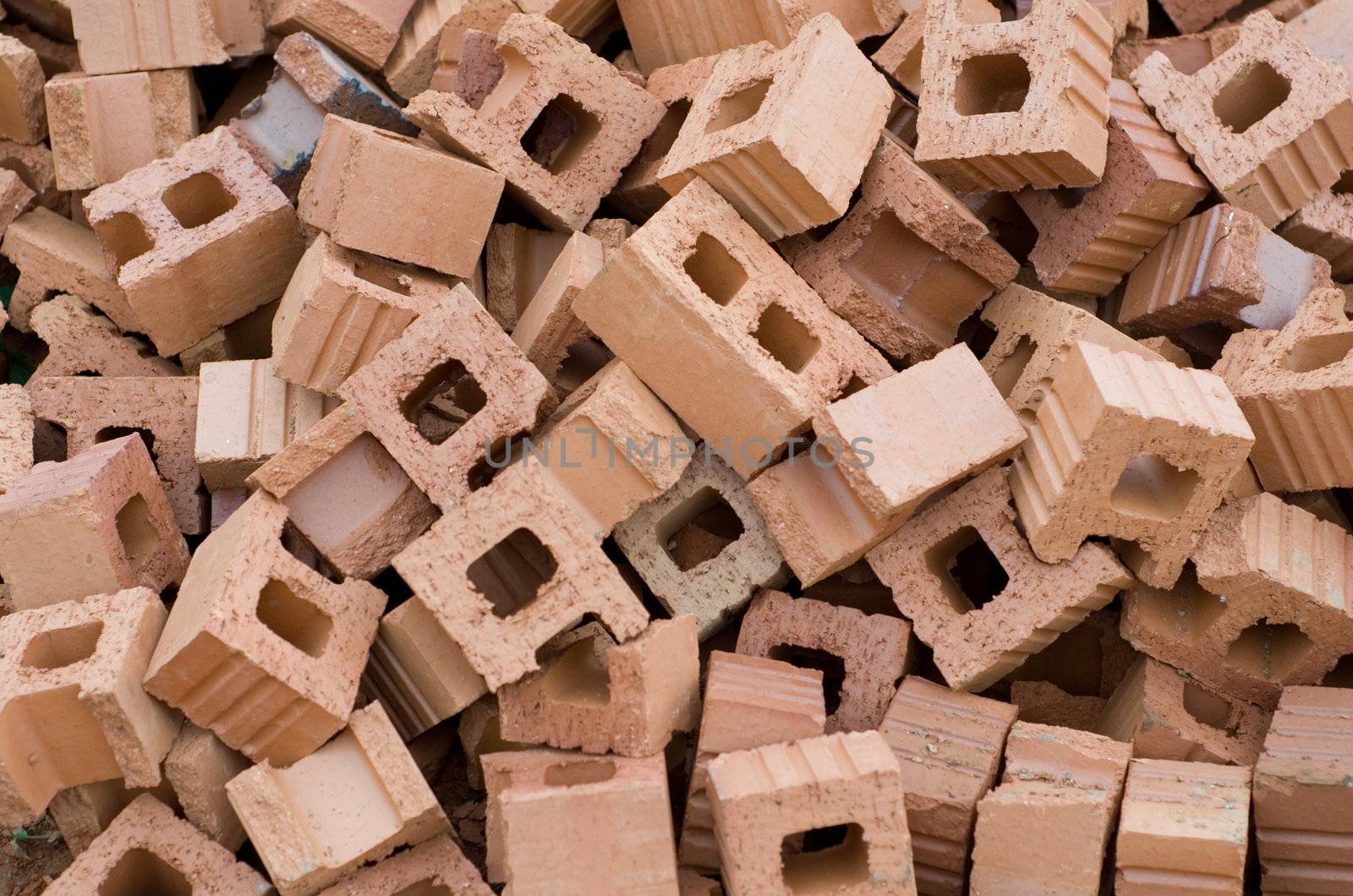 Pile of red bricks on construction site