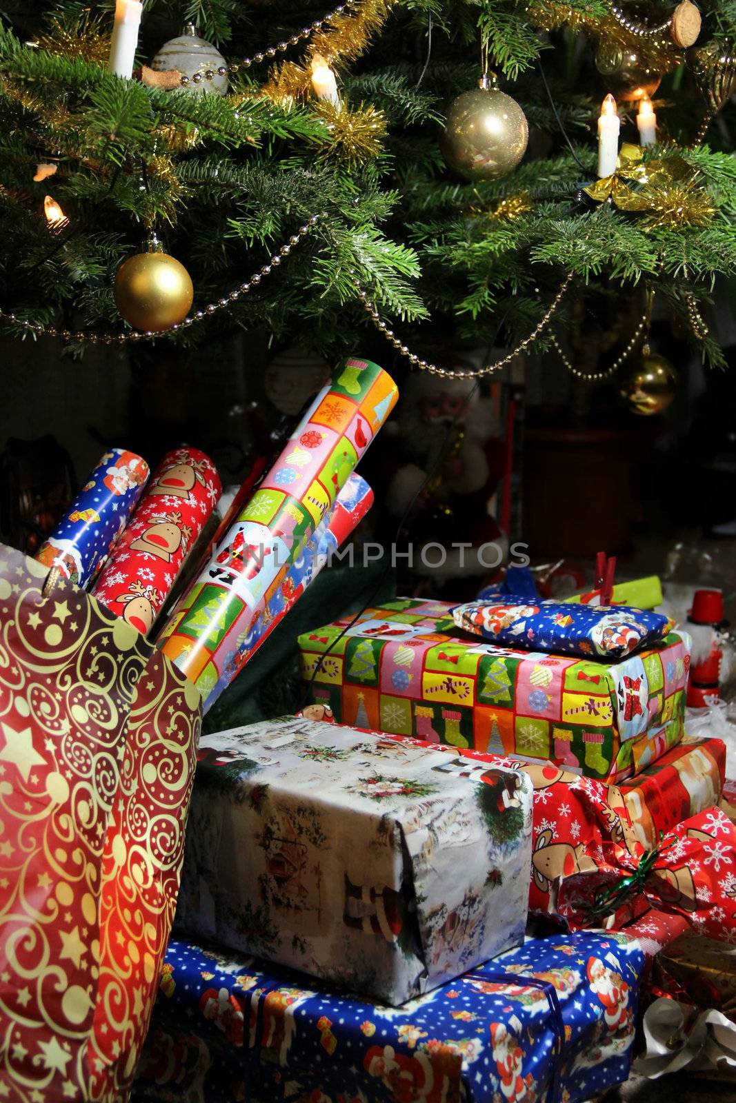 Lot of Christmas gifts wrapped in the beautiful vivid paper 