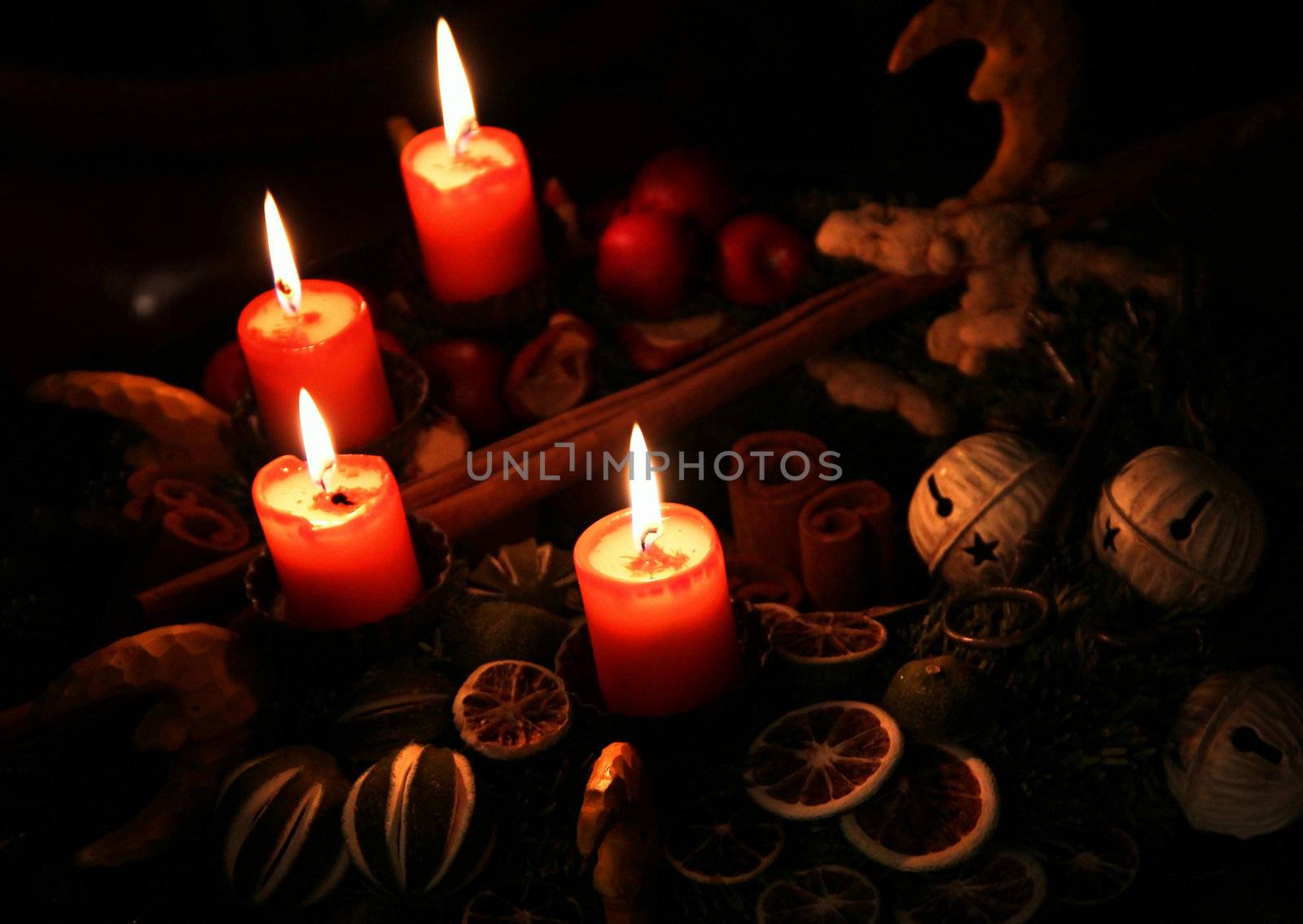 Traditional Christmas wreath and burning candles