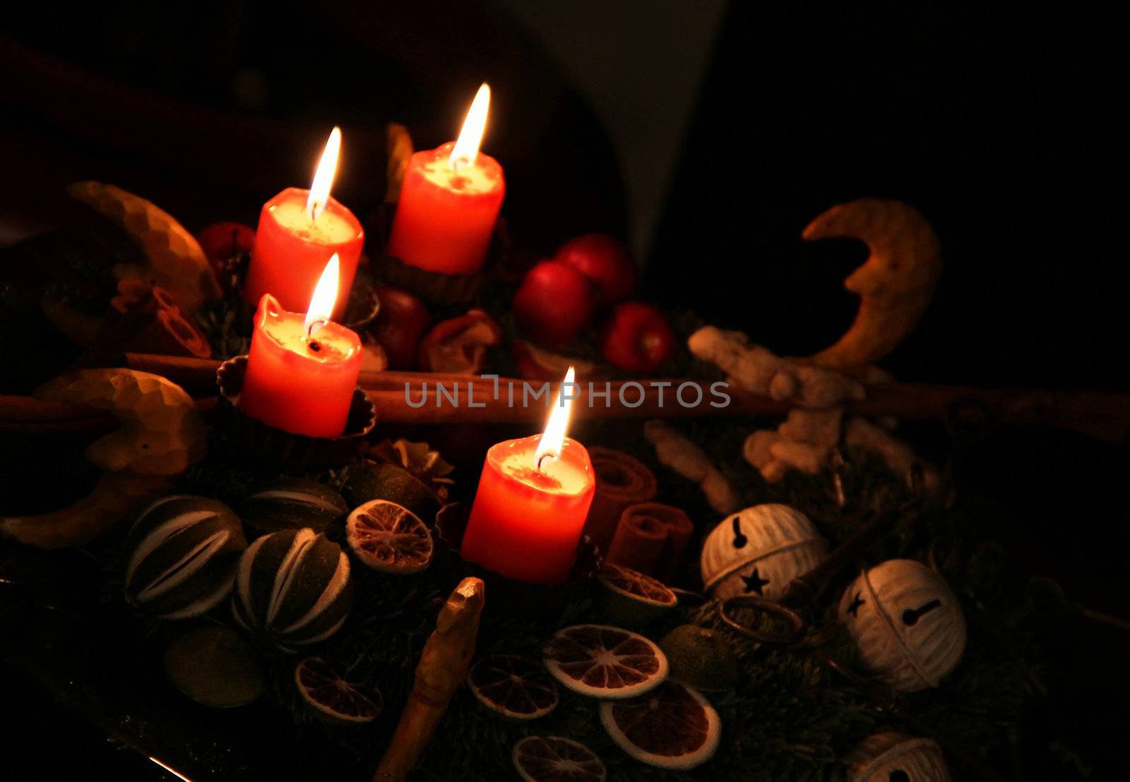 Traditional Christmas wreath and burning candles