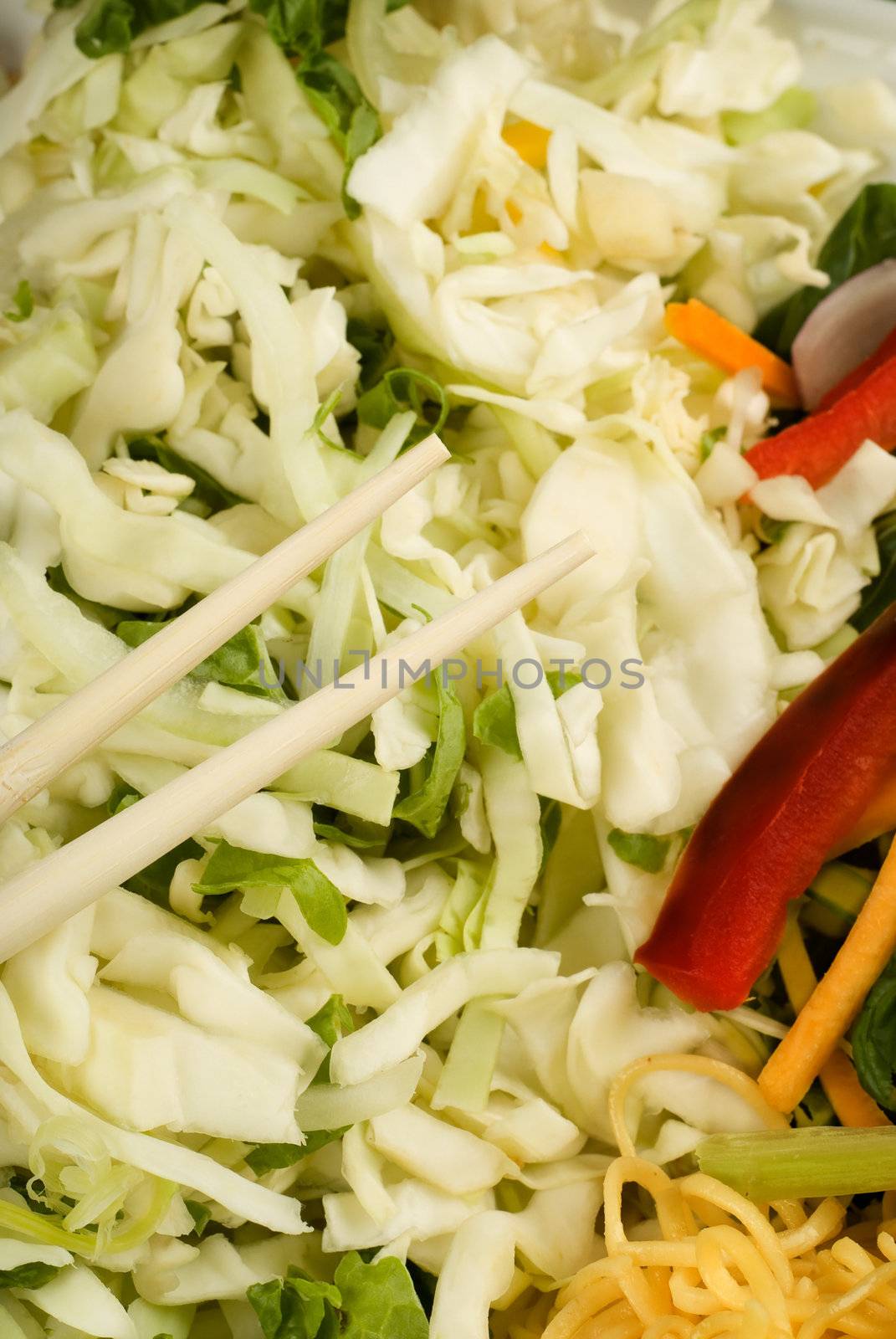 Chop sticks and raw thai food stir fry