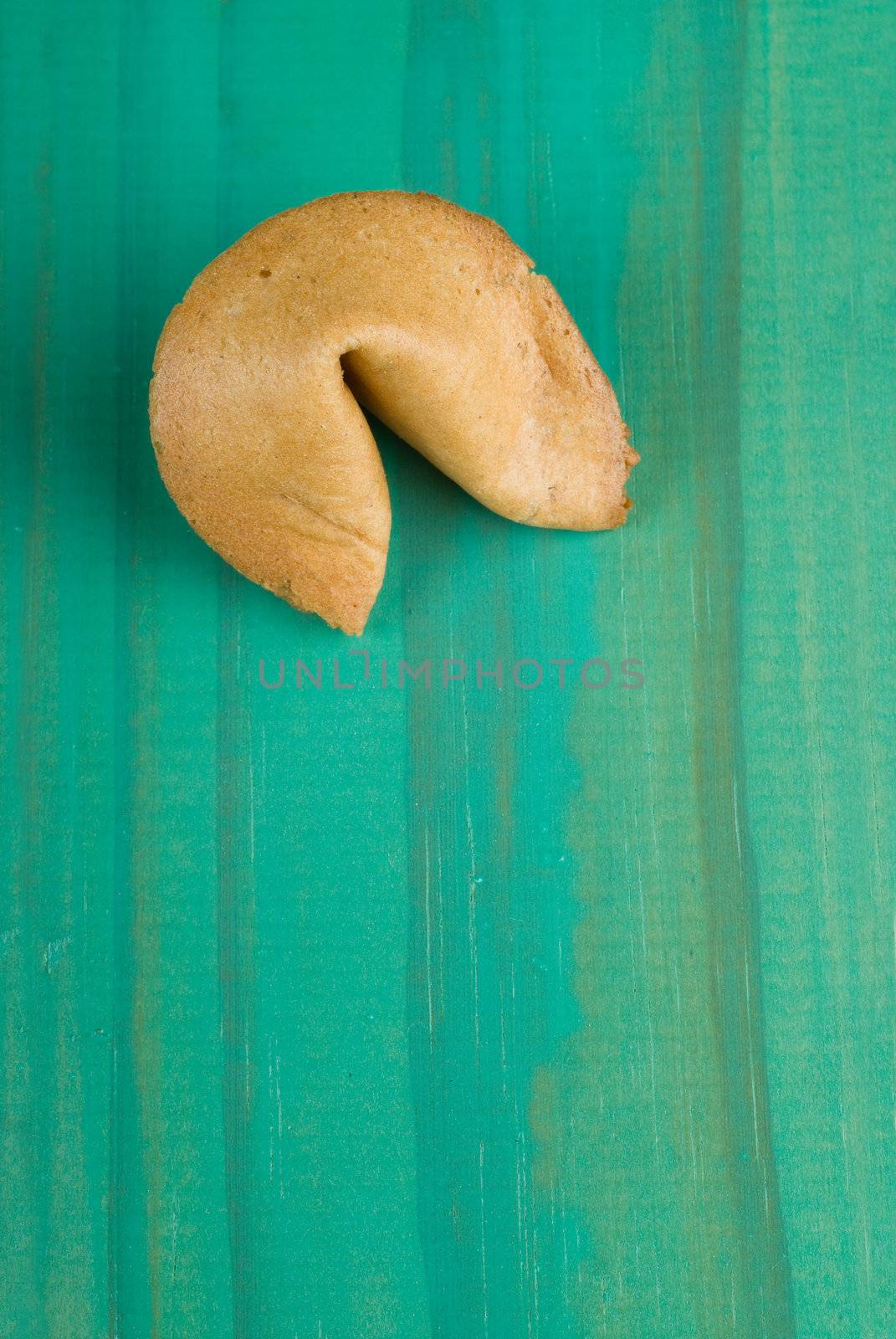 Single one fortune cookie on wooden table
