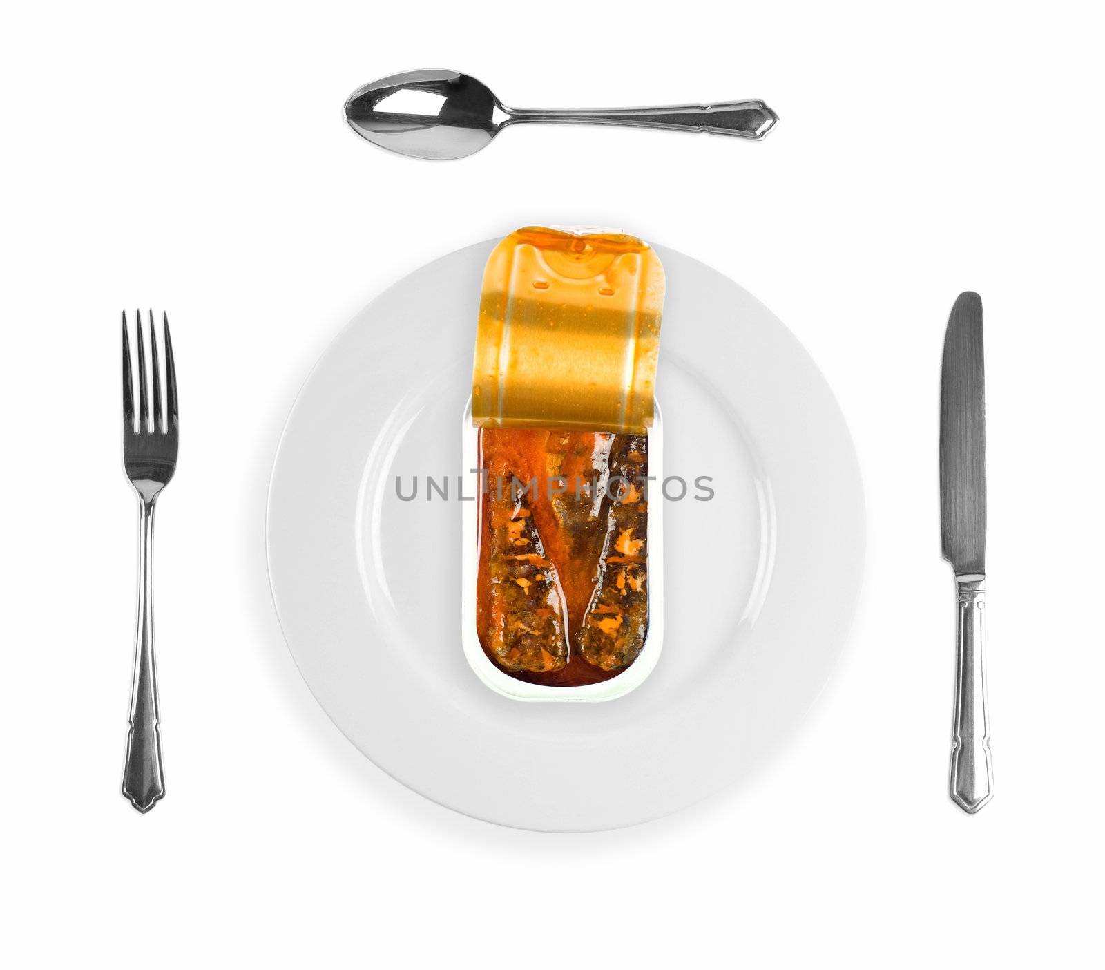 Canned sardines in open aluminum tin on a plate