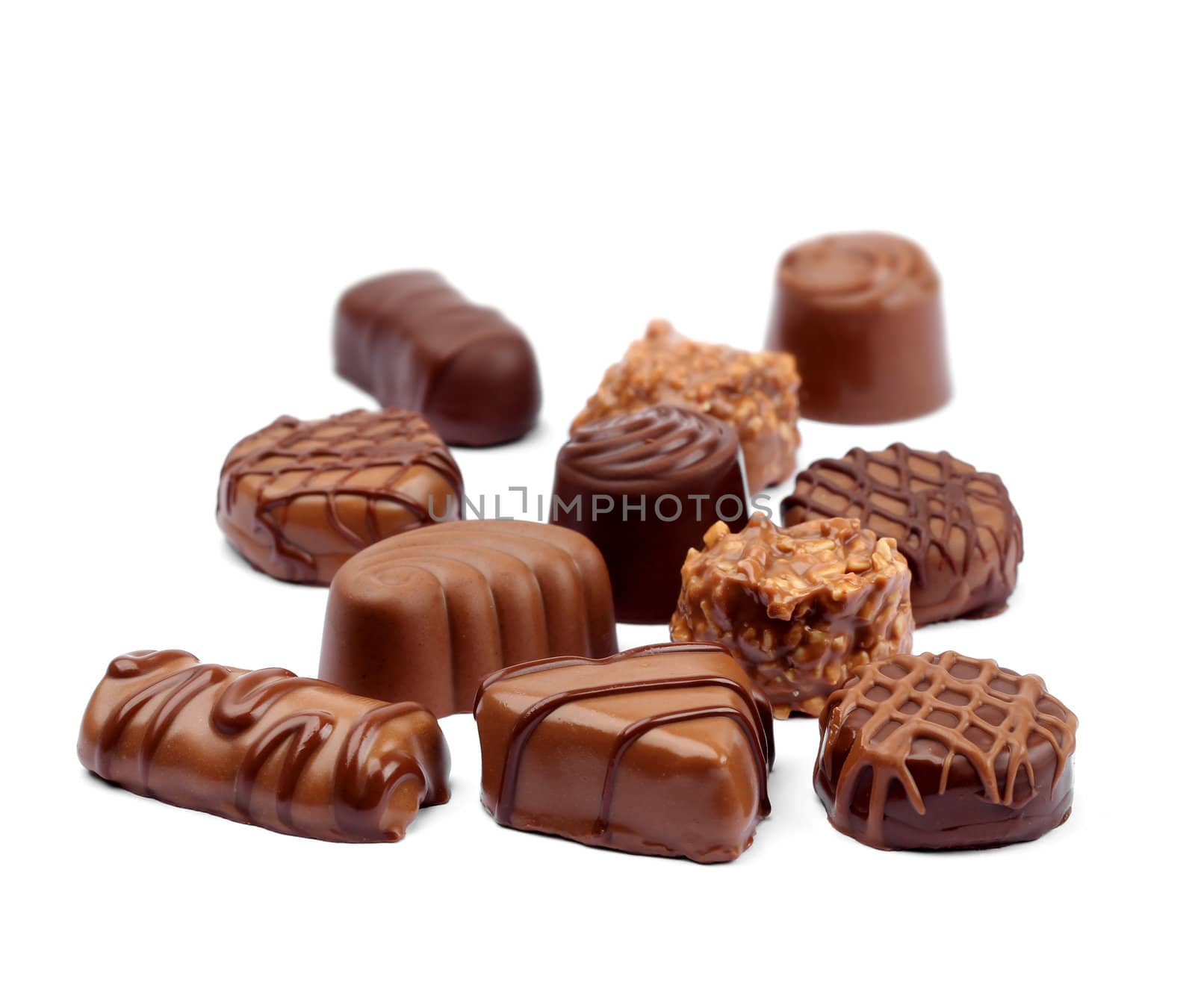 Delicious chocolate confection assortment on white