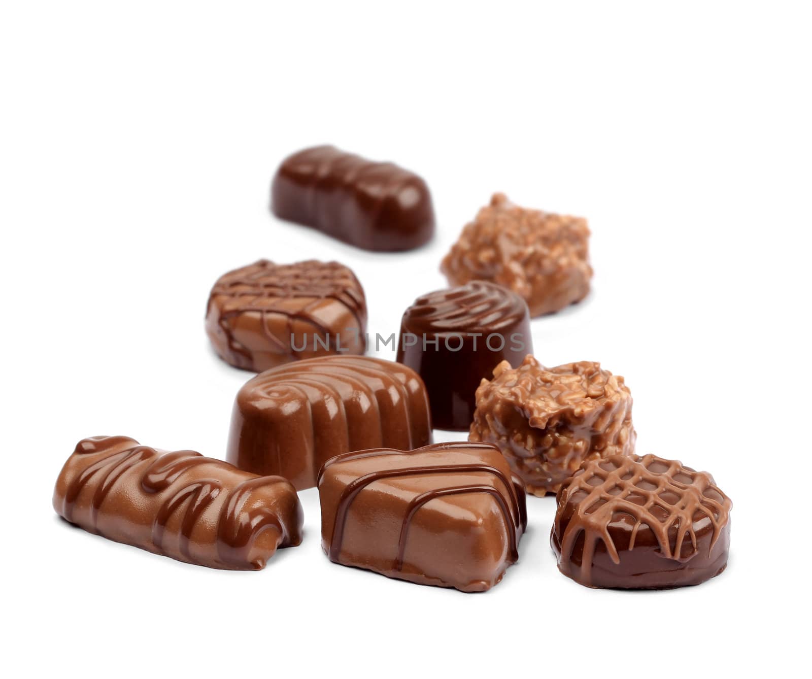 Delicious chocolate confection assortment on white