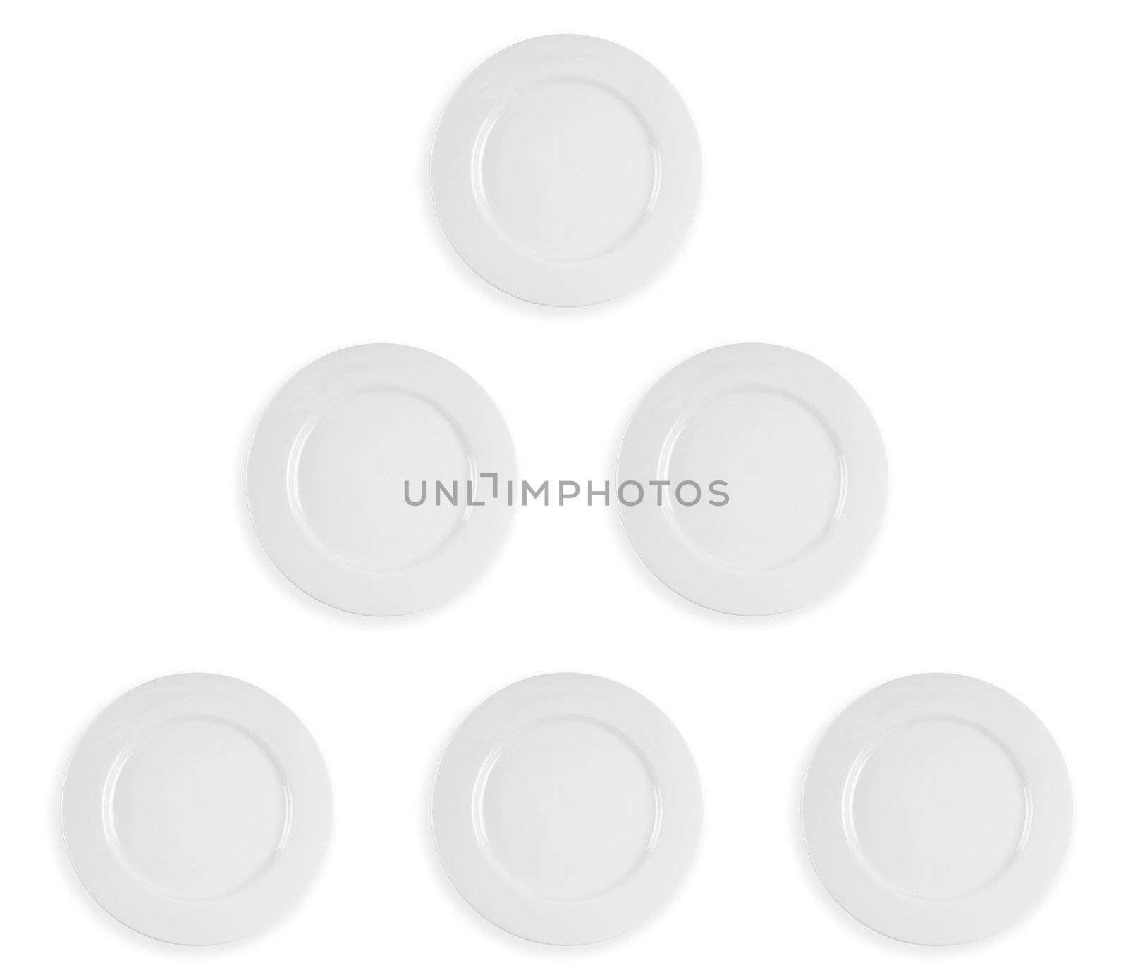 Image composite of five clean white dinner plates in a pyramid