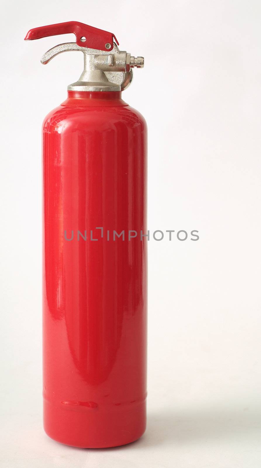 Red fire extinguisher on white