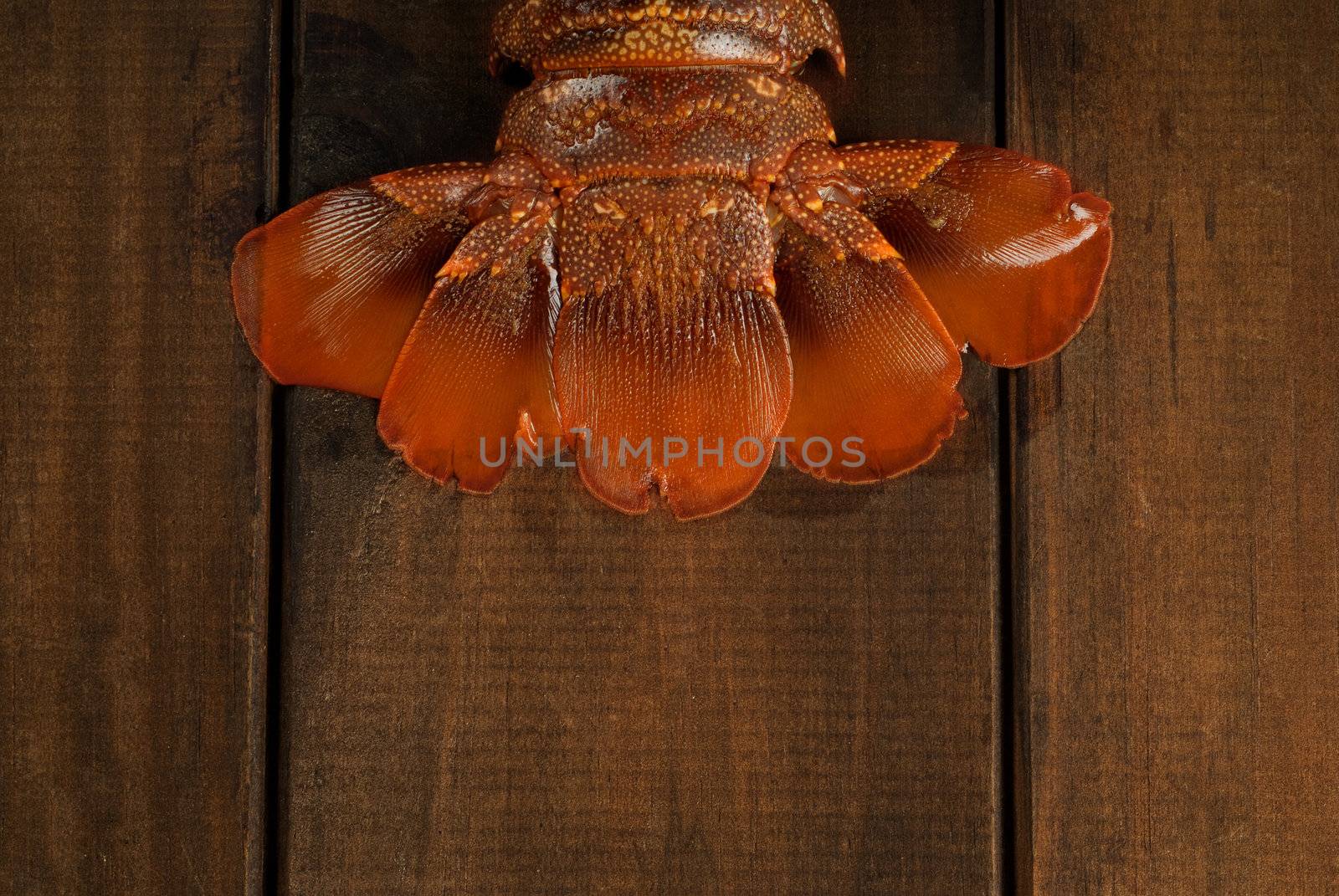Crayfish or lobster tail on wooden table