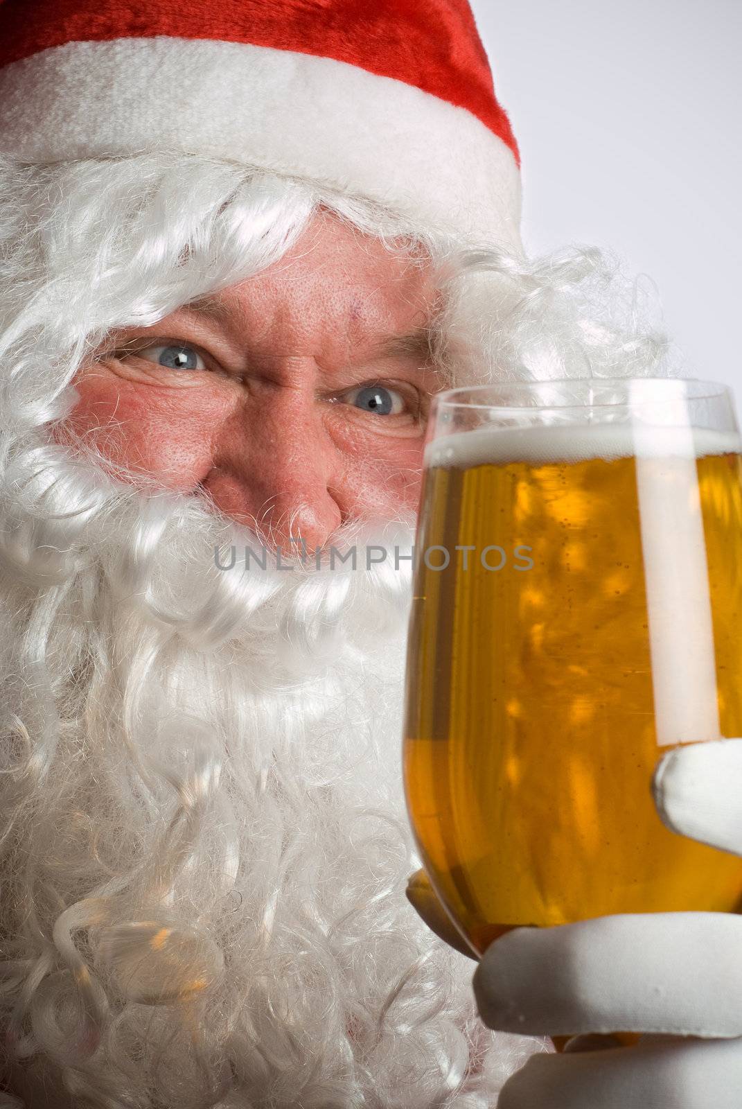 Father Christmas Santa looks at a lovely glass of beer
