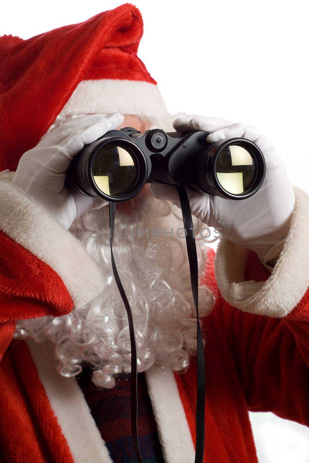 Close up of Father Christmas looking at the future business strategy with binoculars to the front