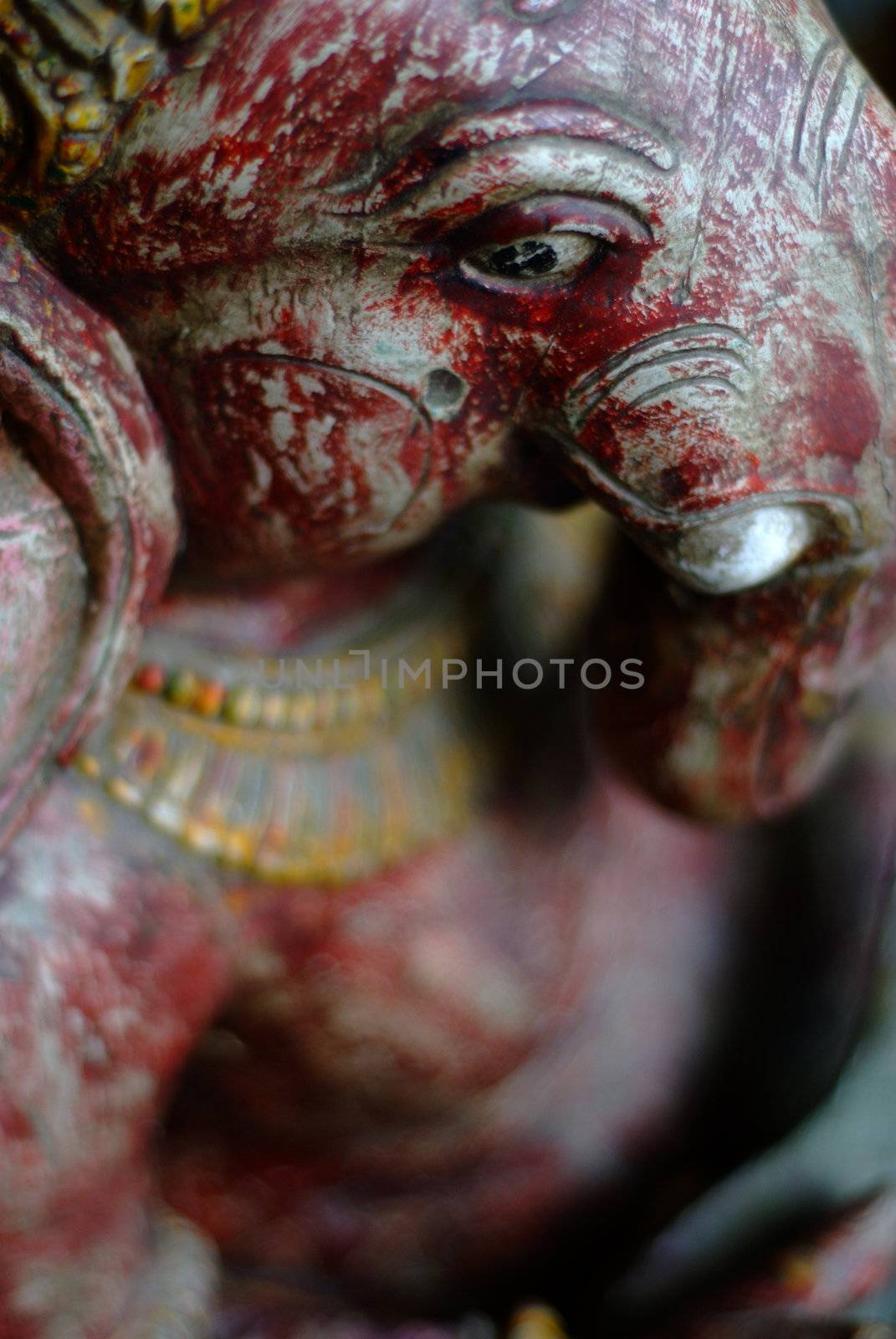 Ganesh or Ganesha Hindu elephant god idol close up selective focus on eye