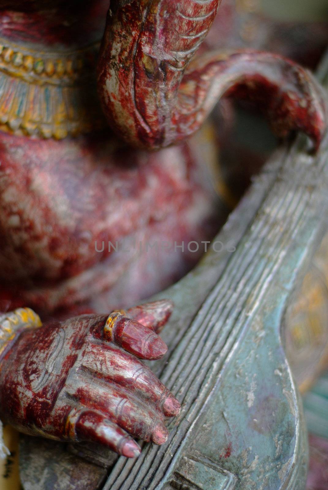 Ganesh playing musical instrument closeup by alistaircotton