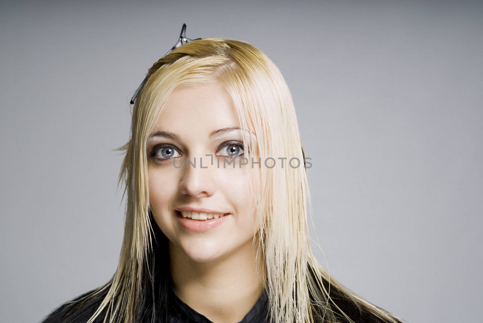 Wet hair customer ready for hairdresser haircut looking at you