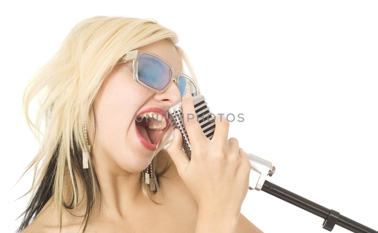 Pretty woman or girl music singer with microphone and sunglasses on white