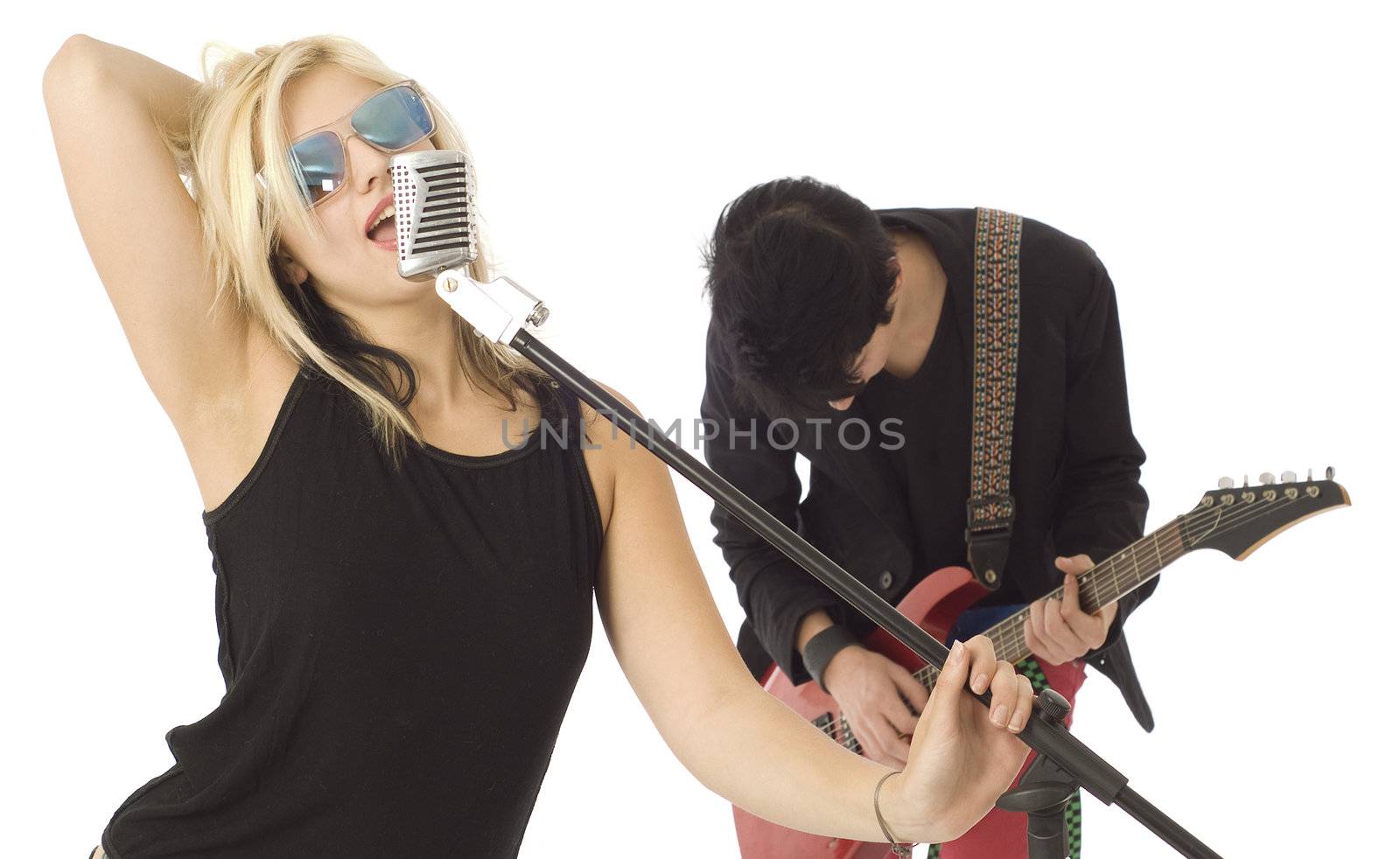 Woman music singer and rocking male guitarist in garage band isolated on white