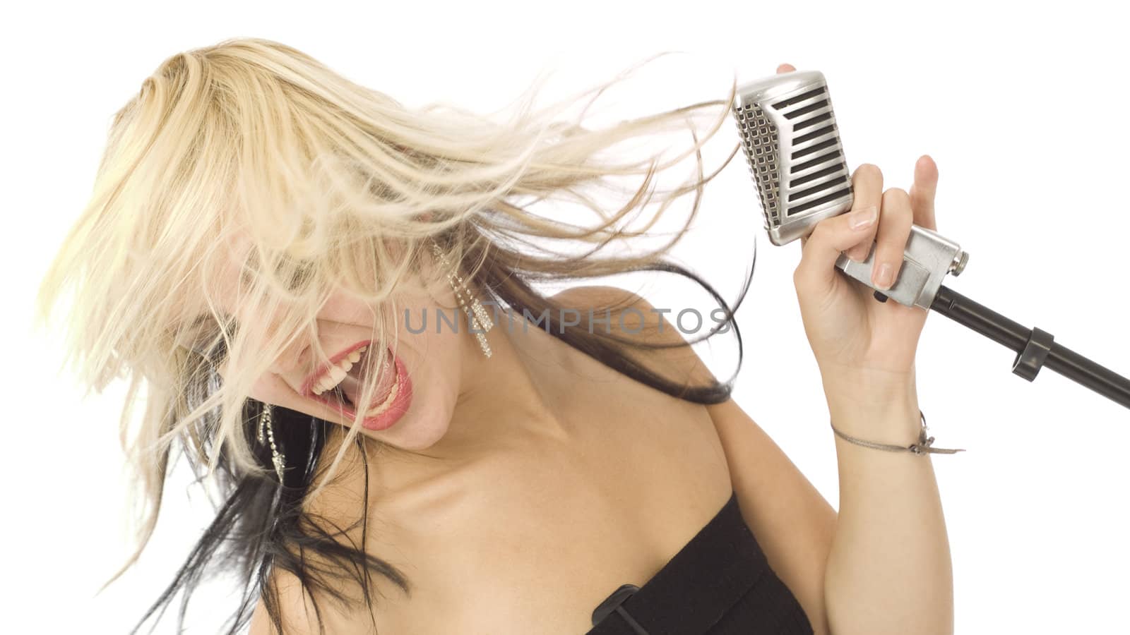 Rocking singer with mouth open, wild hair and microphone