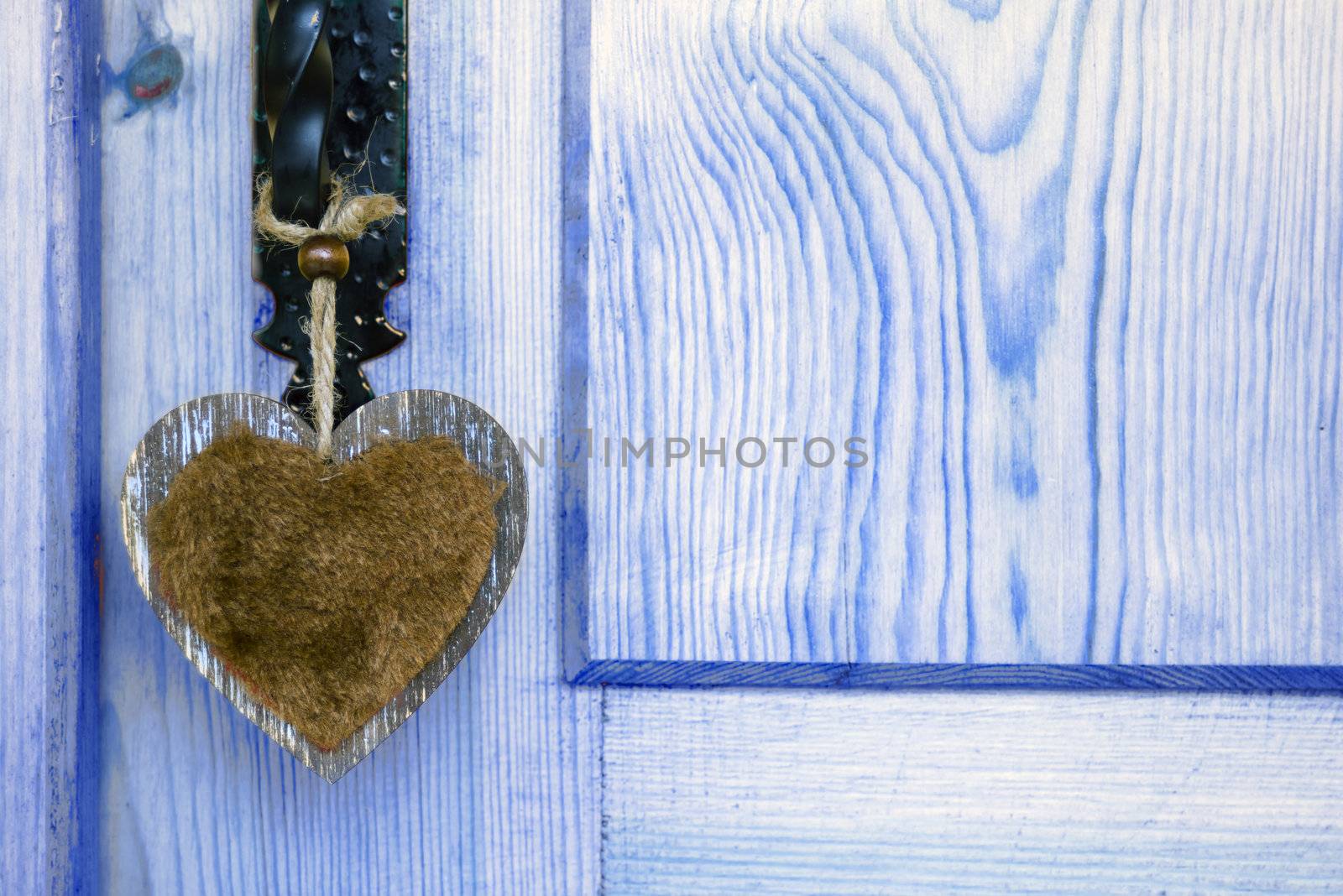 door with a hanging heart, country style