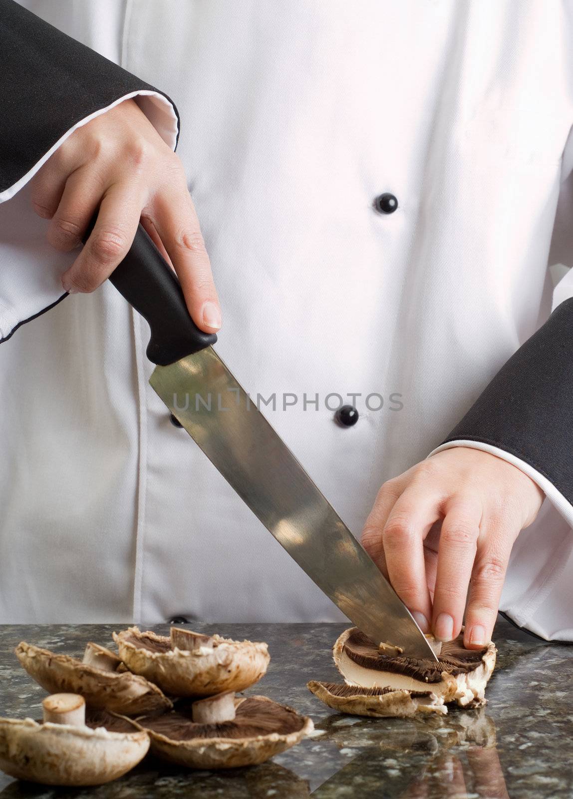 Chef Cutting Brown Mushrooms by alistaircotton