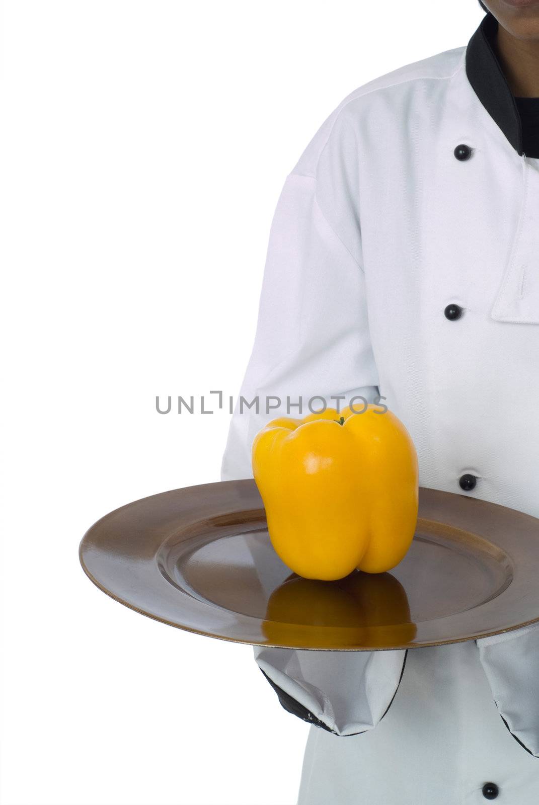 Studio isolated woman female chef with yellow pepper on white