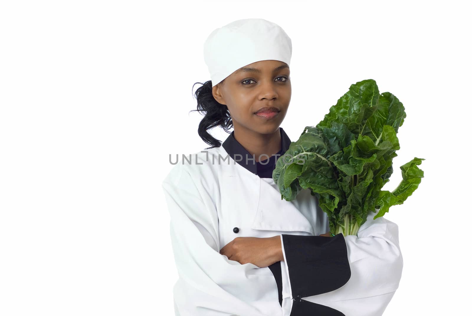 Studio isolated woman female chef and fresh green spinach vegetable