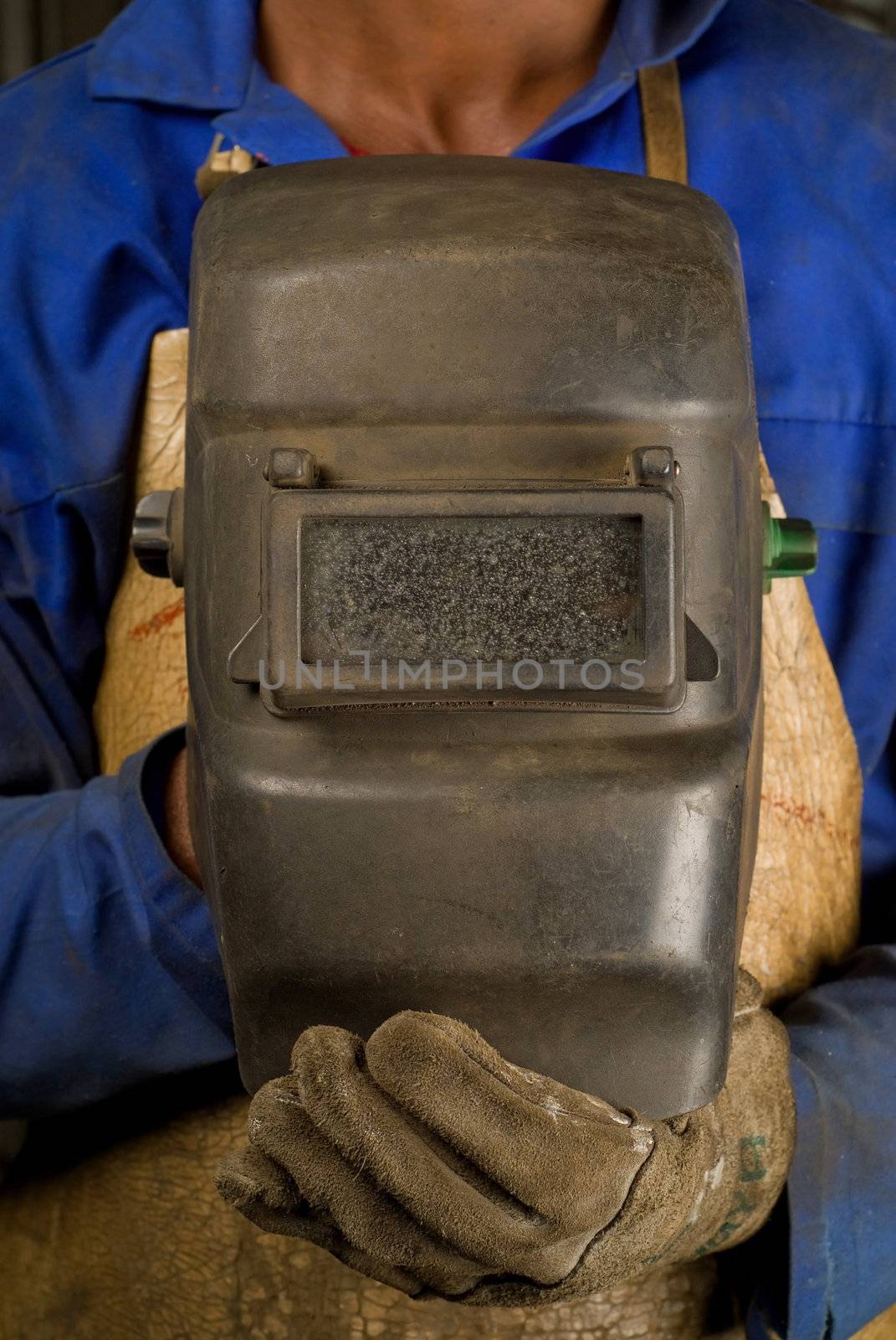 South African or black American welder worker with mask