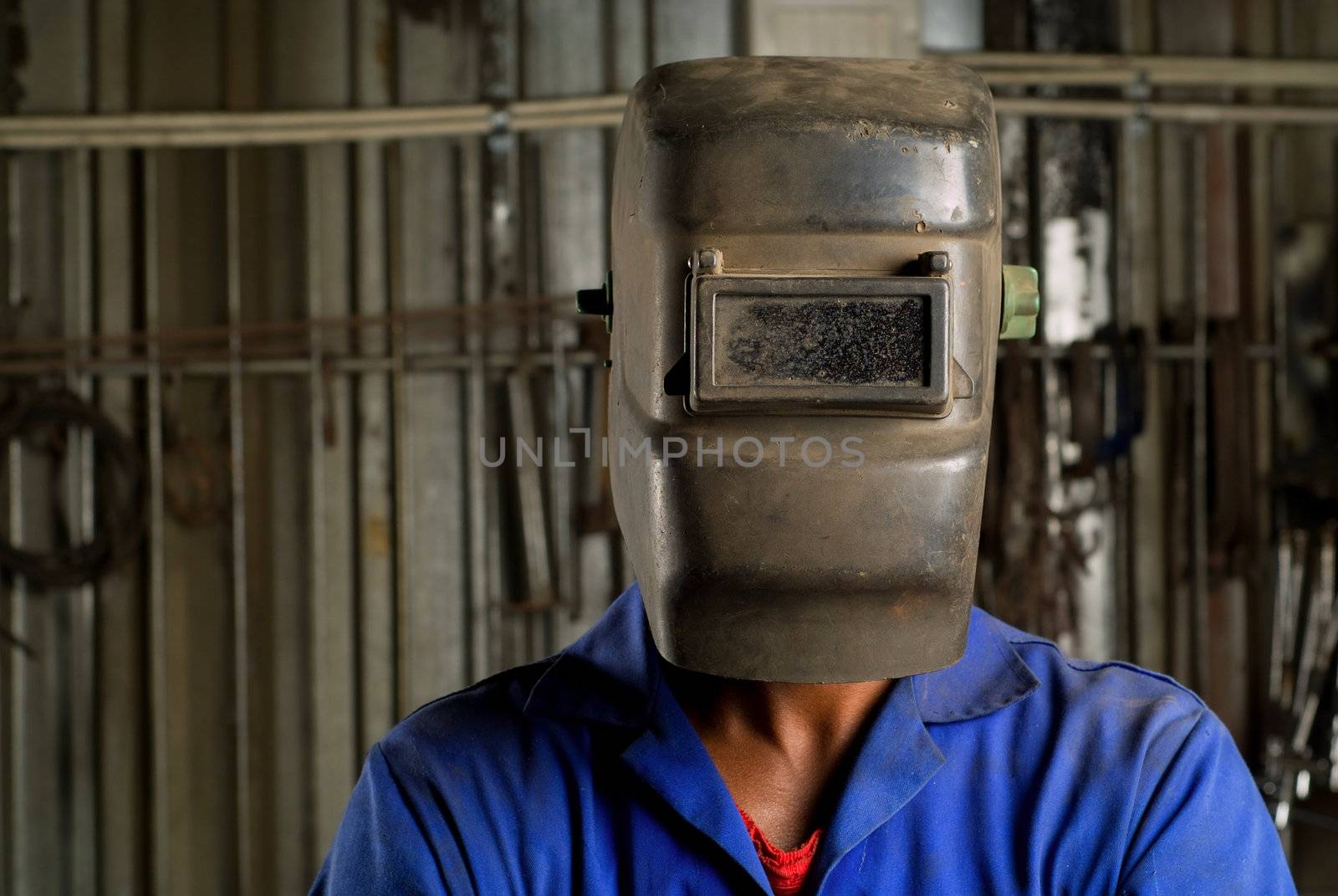 South African or American black worker welder in factory