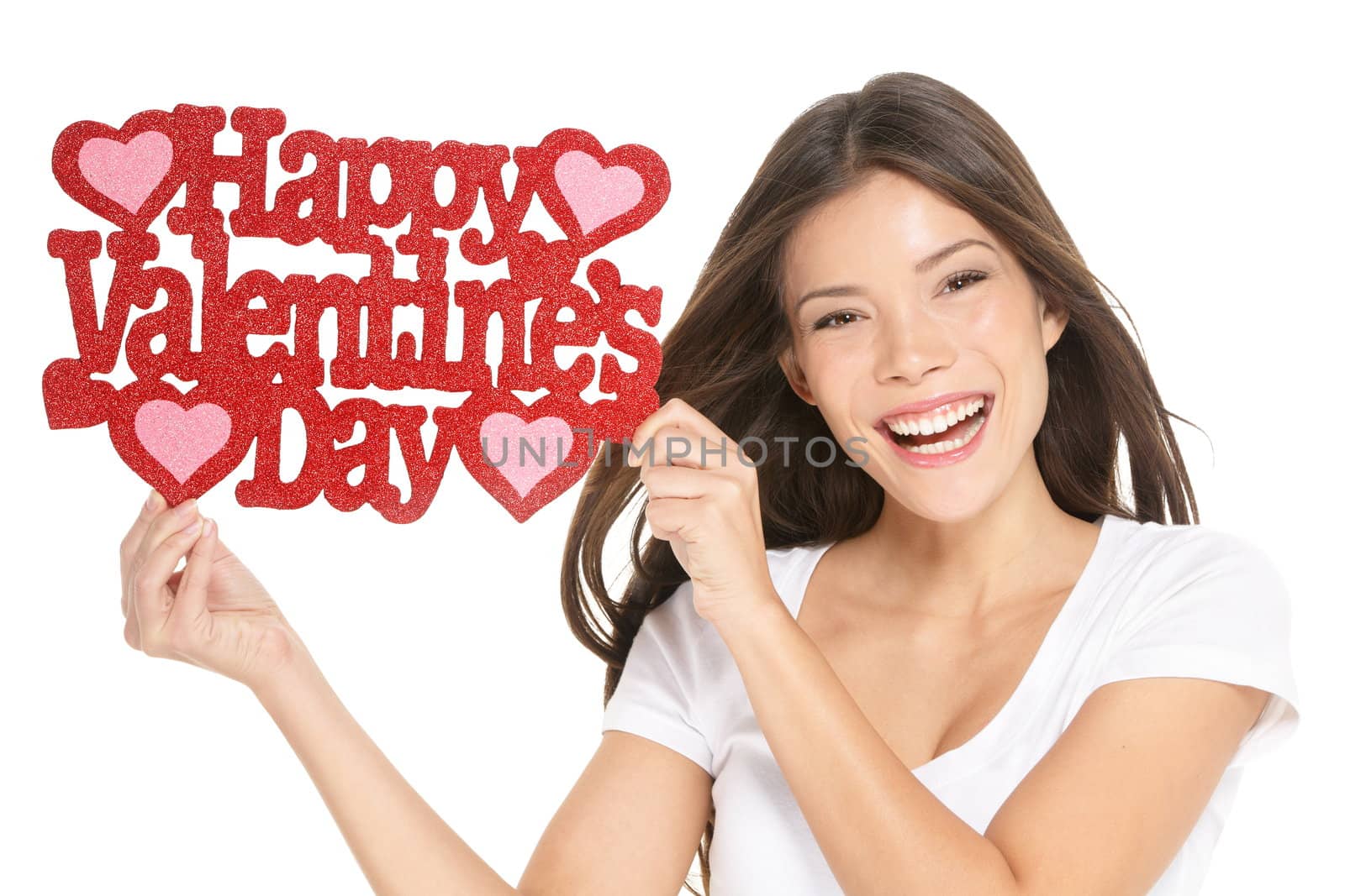 Valentines day. Woman showing holding sign excited with the text VALENTINES DAY.  Lovely happy multiracial Caucasian / Asian Chinese young woman isolated and cut out on white background in studio.
