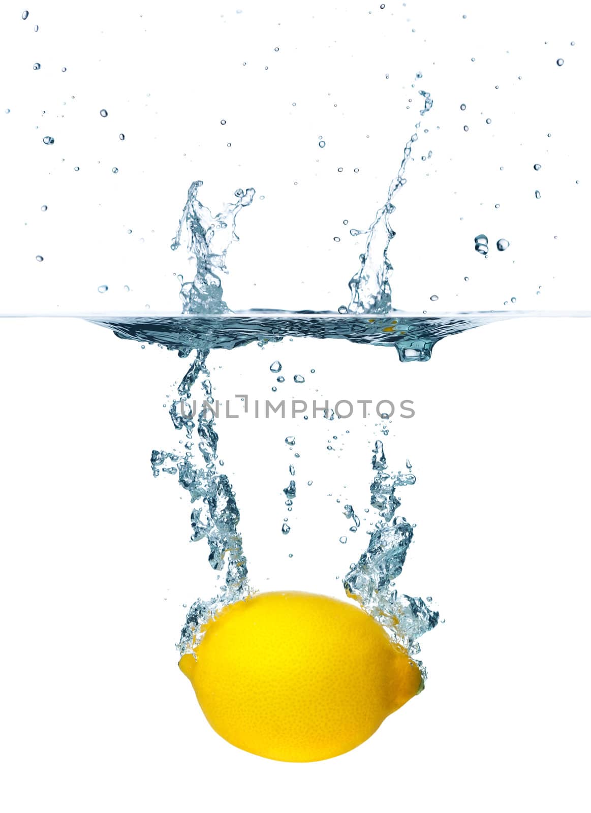 Fresh lemon falling into water. Isolated on white background