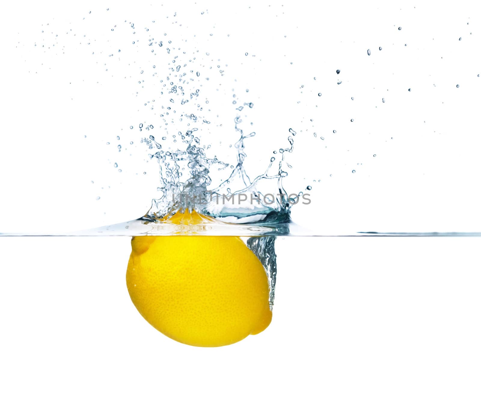 Fresh lemon falling into water. Isolated on white background