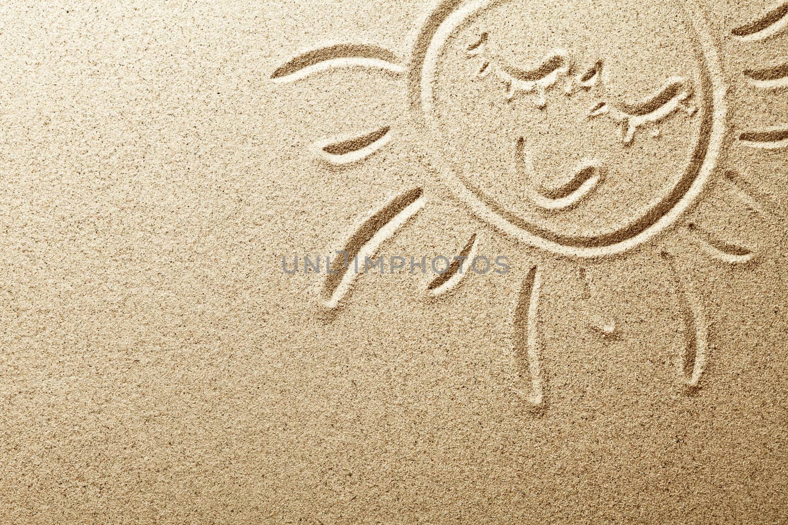 Sun drawn in the sand. Beach background. Top view
