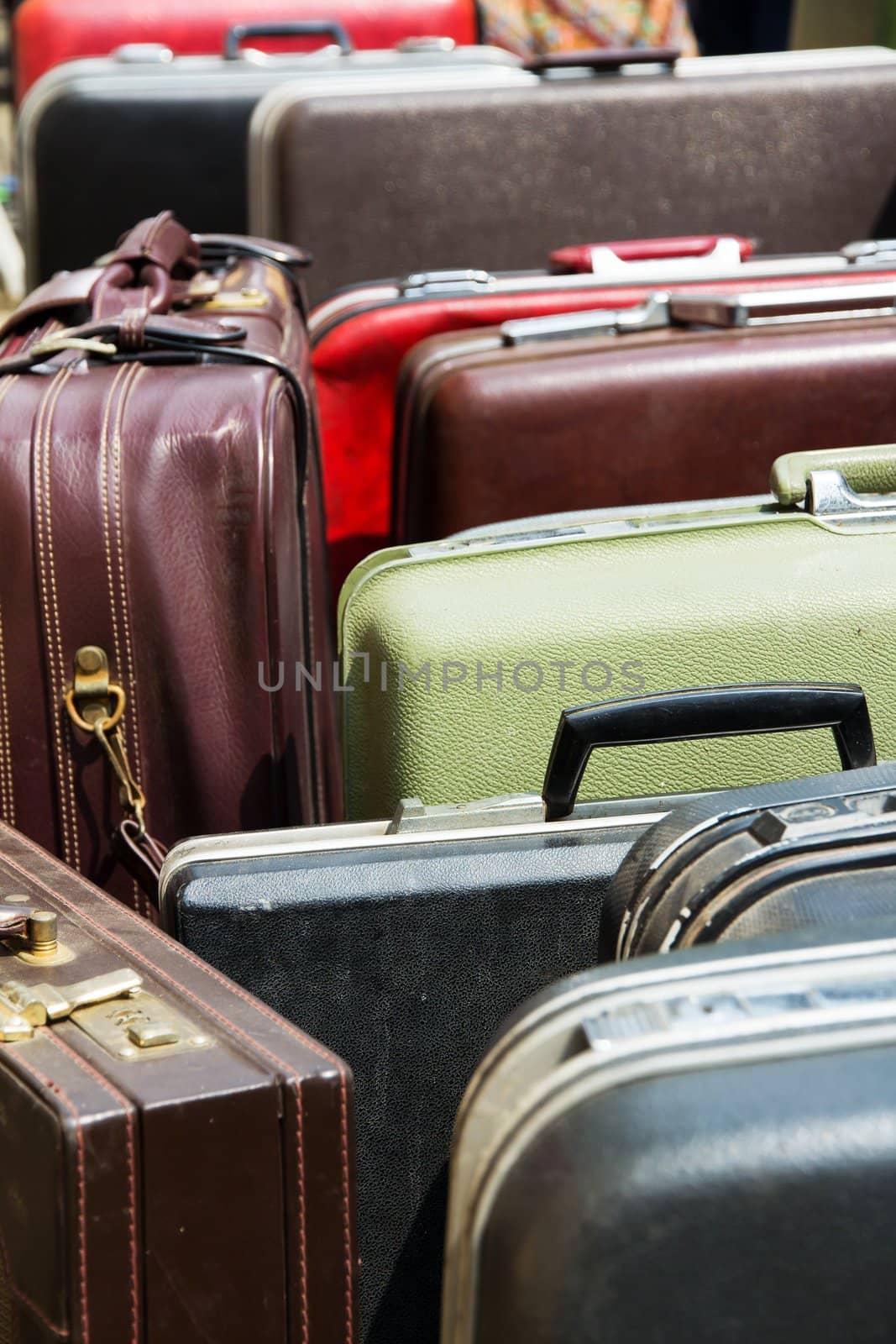 Pile of old vintage bag suitcases by ponsulak