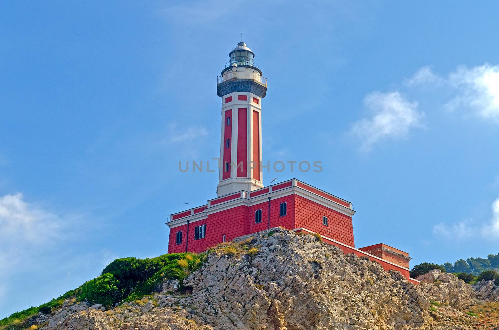 Red Lighthouse seen on the island of Capri, Italy, shot from a boat