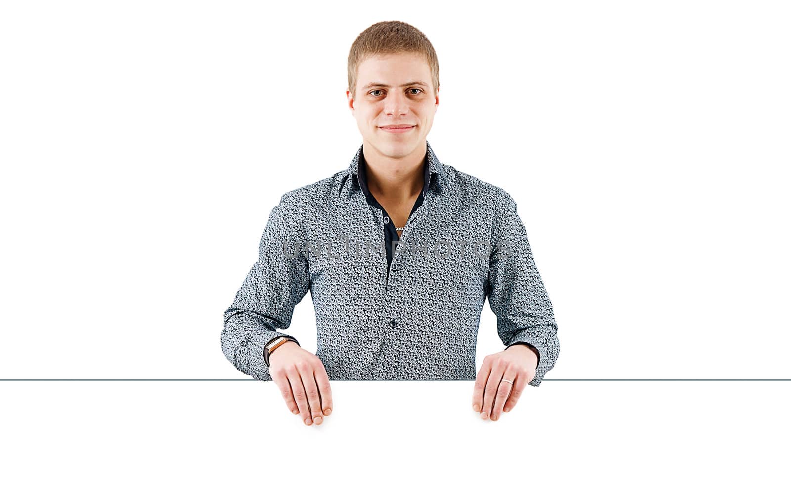 smiling young man with a white poster