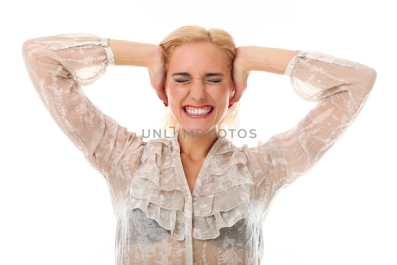 Portrait of blonde caucasian woman holding hands on her ears against white background