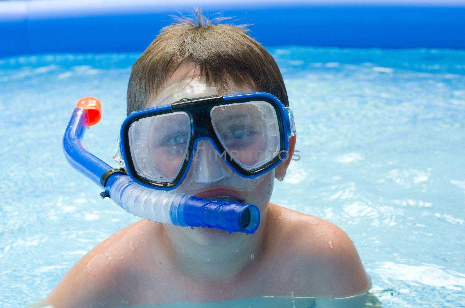 Close up of boy swimming in pool