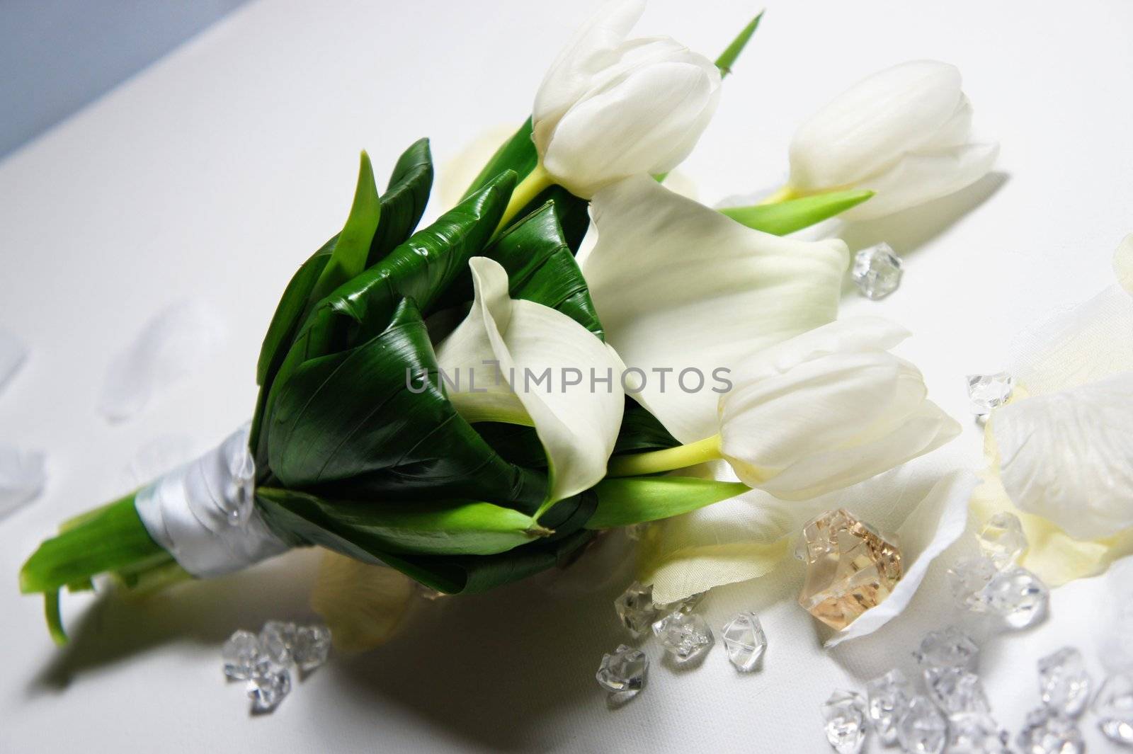 Beautiful wedding bouquet with tulips and lilac and lot of crystals and pearls           
