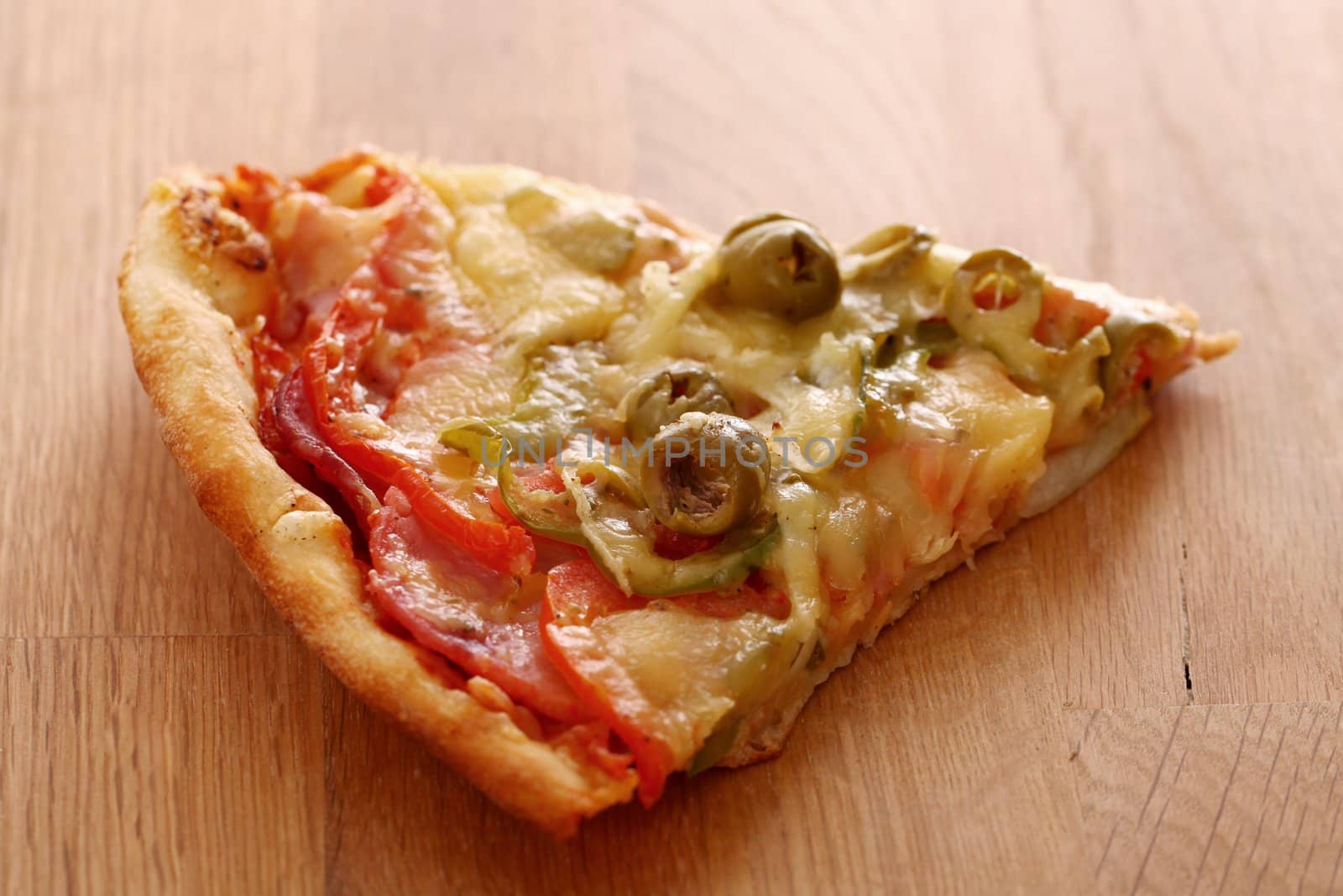 Slice of fesh italian pizza over wooden background