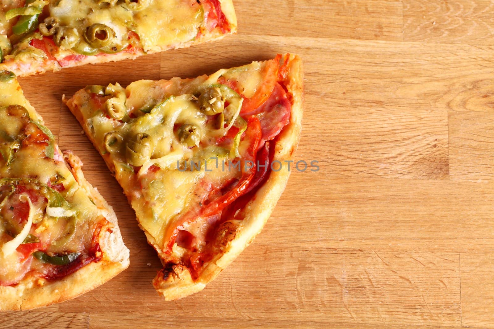 Image of fresh italian pizza on a wooden suface