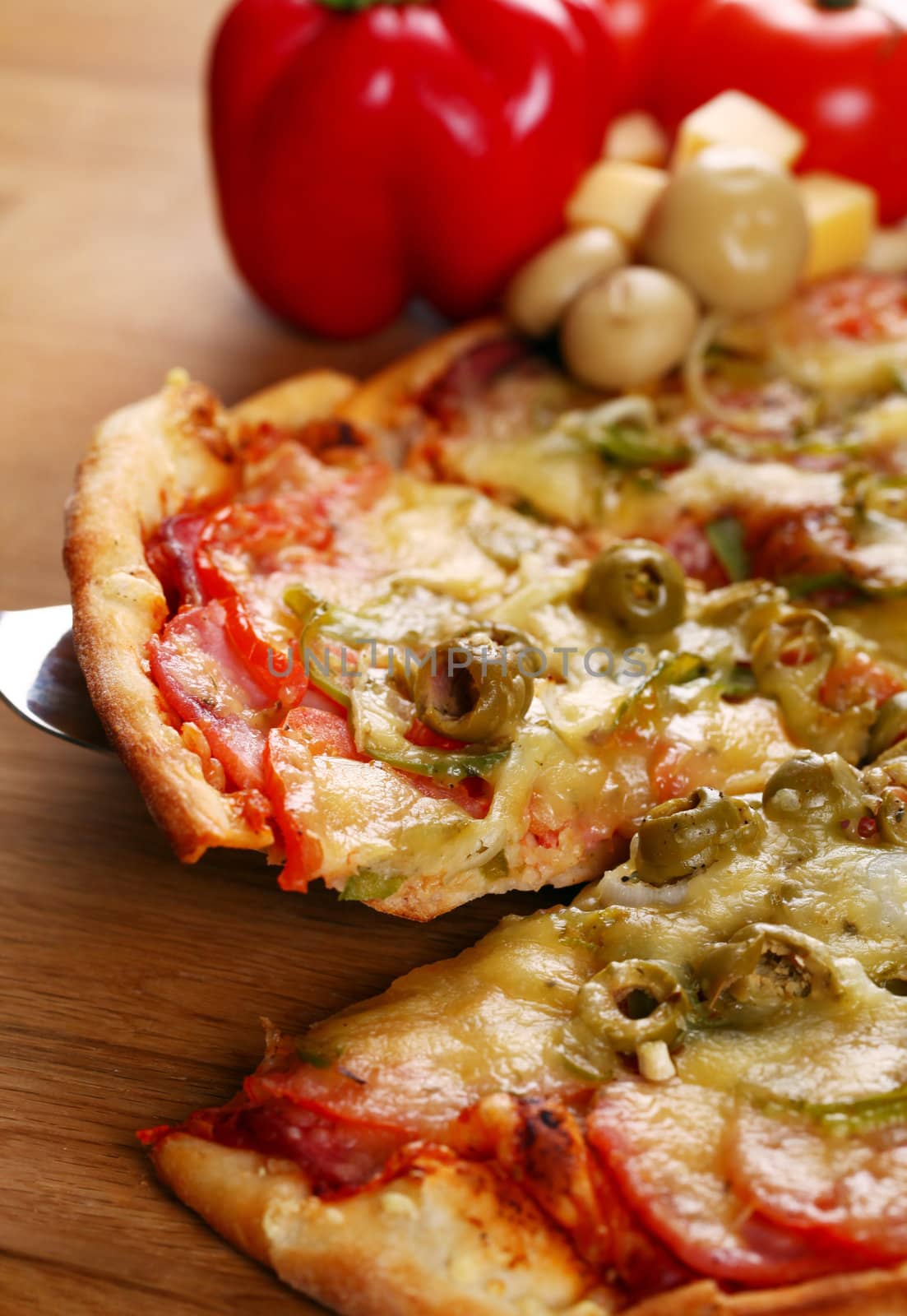 Image of fresh italian pizza on a wooden suface