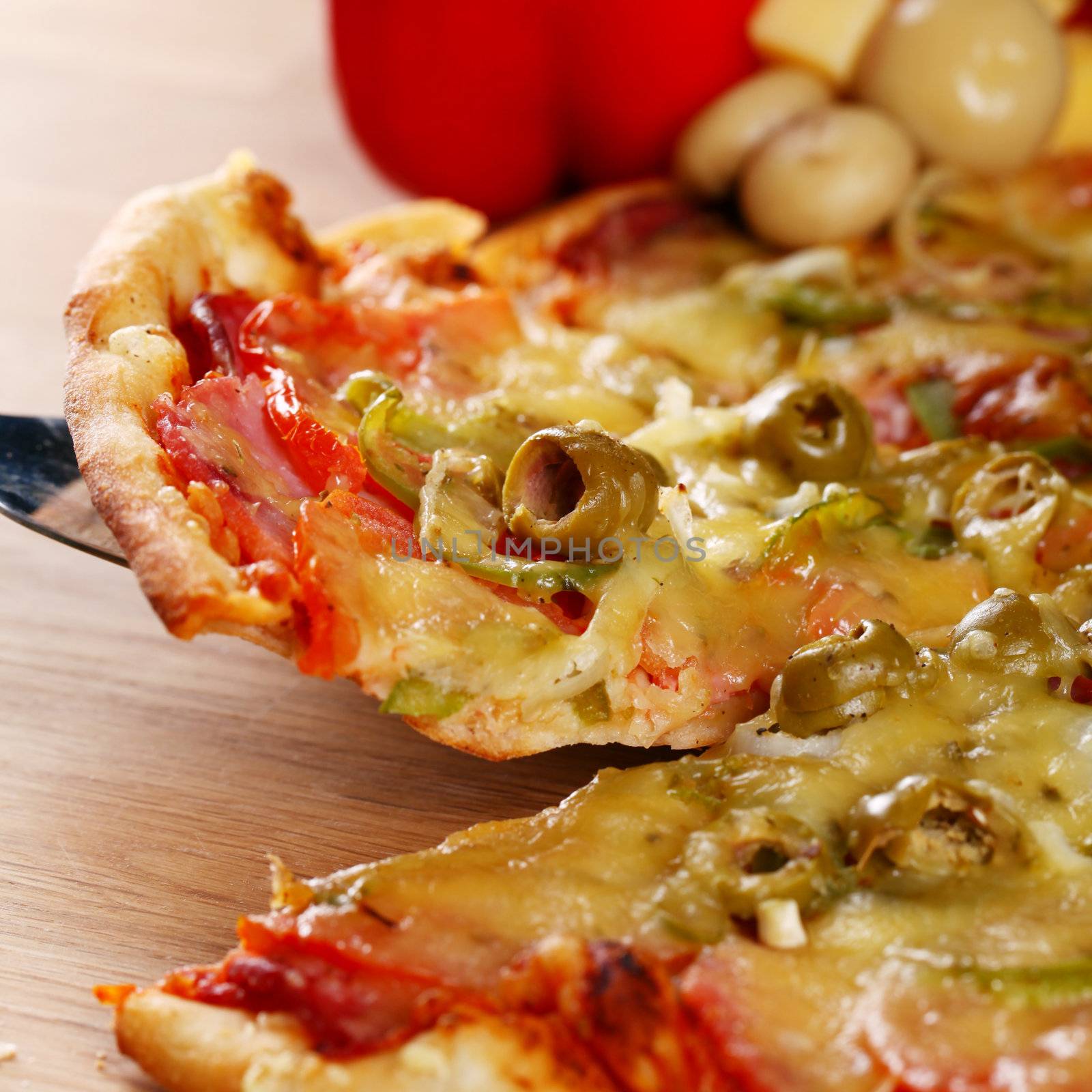 Image of fresh italian pizza on a wooden suface