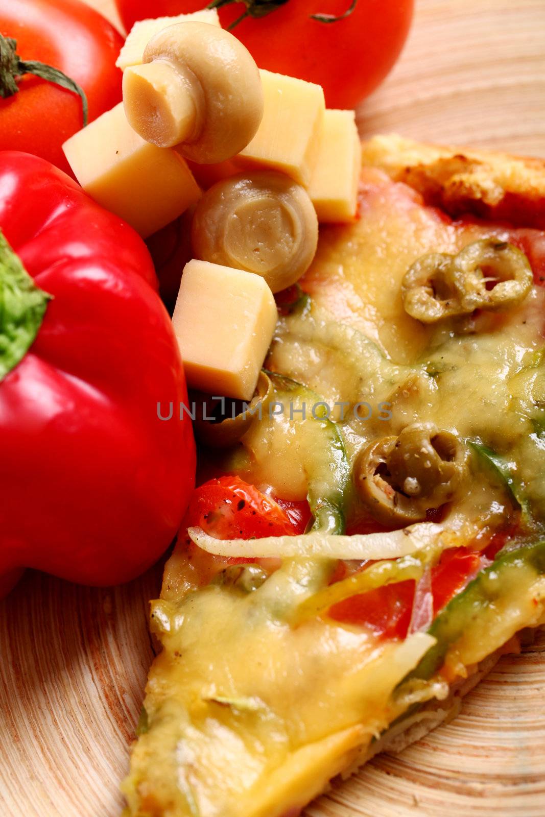 Closeup of tasty italian pizza with vegetables and meat