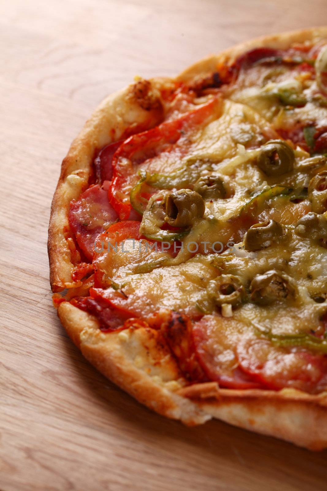 Image of fresh italian pizza on a wooden suface