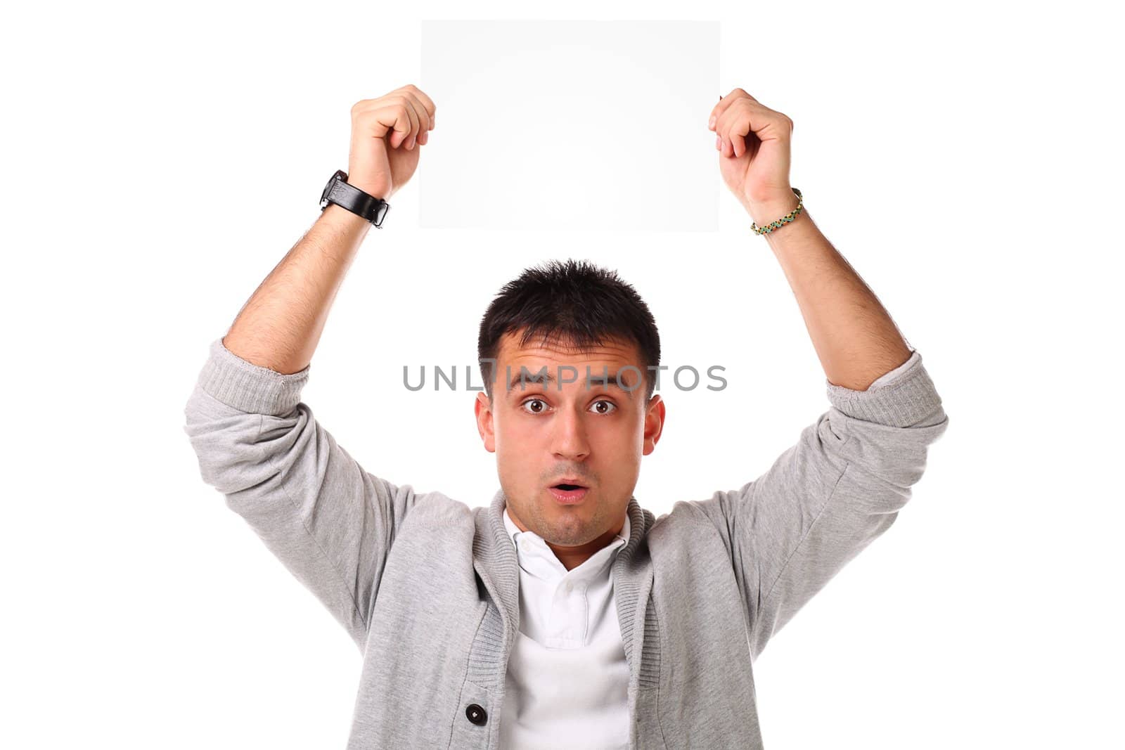 Young handsome man holding blank board ready for text on white background