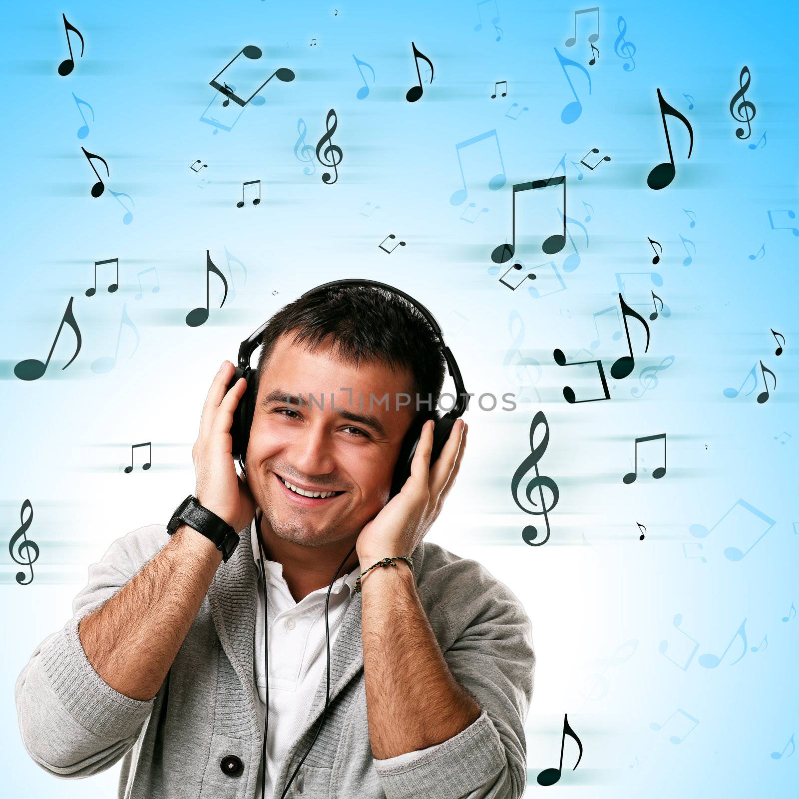 Young caucasian handsome man listening music isolated over background with notes