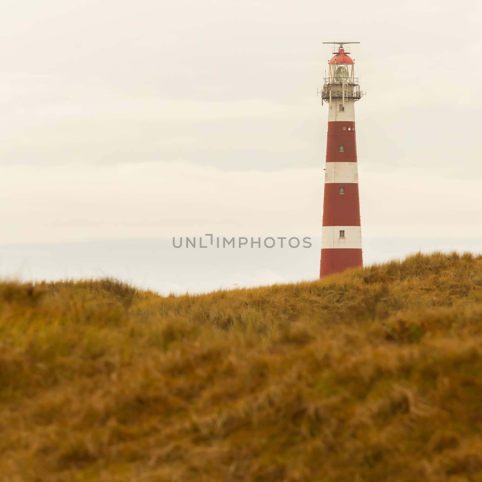 Red and white lighthouse on the dutch isle of Ameland, Holland