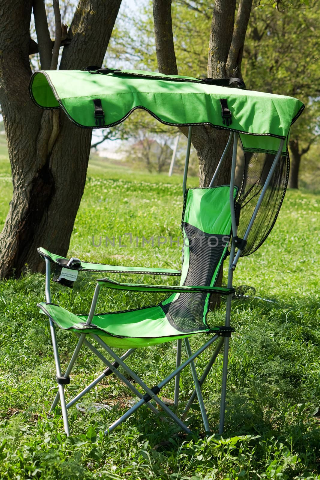Fisherman's (working) chair  against a background of green grass